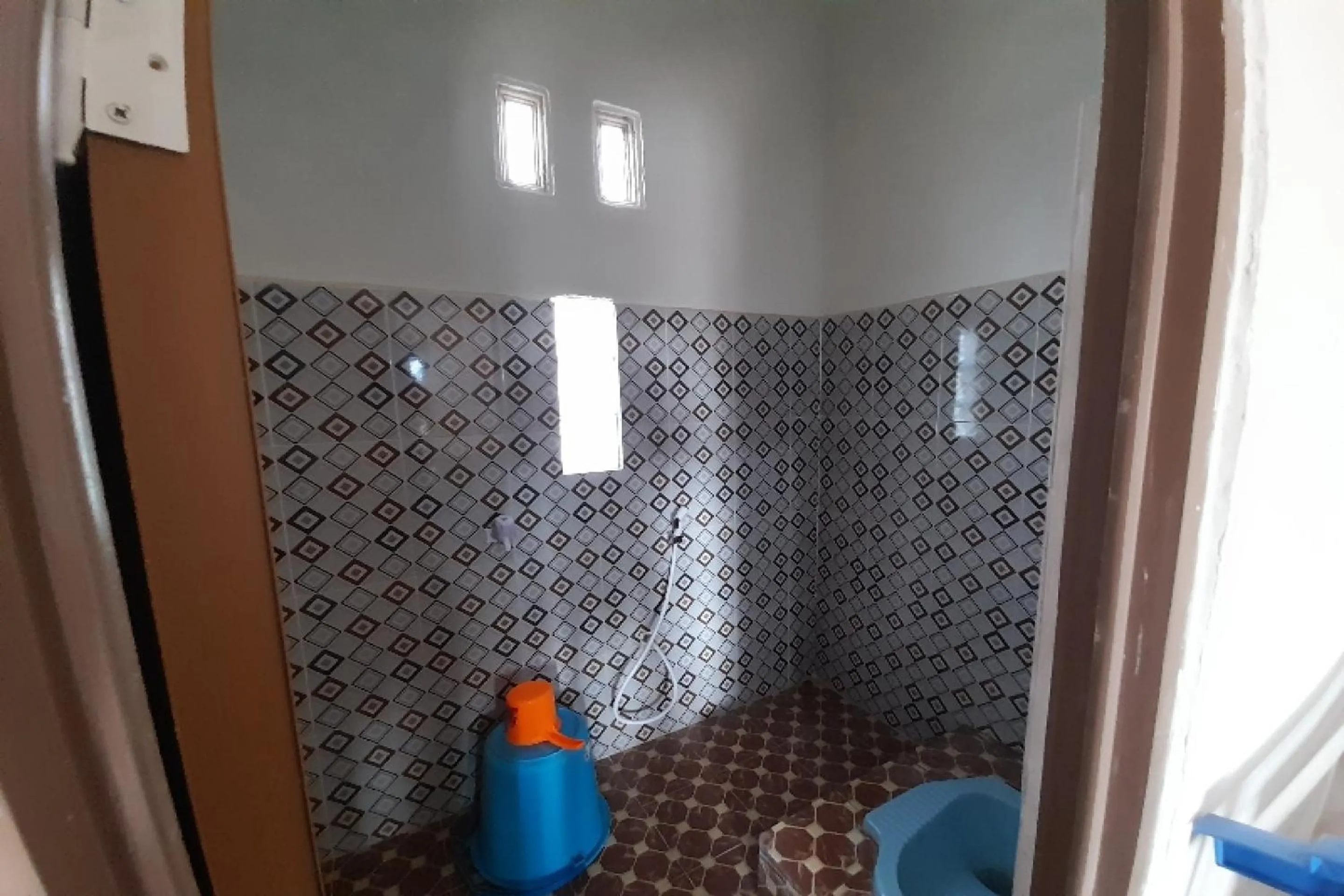 Bathroom in OYO HOMES 91248 Desa Wisata Banding Agung Danau Ranau