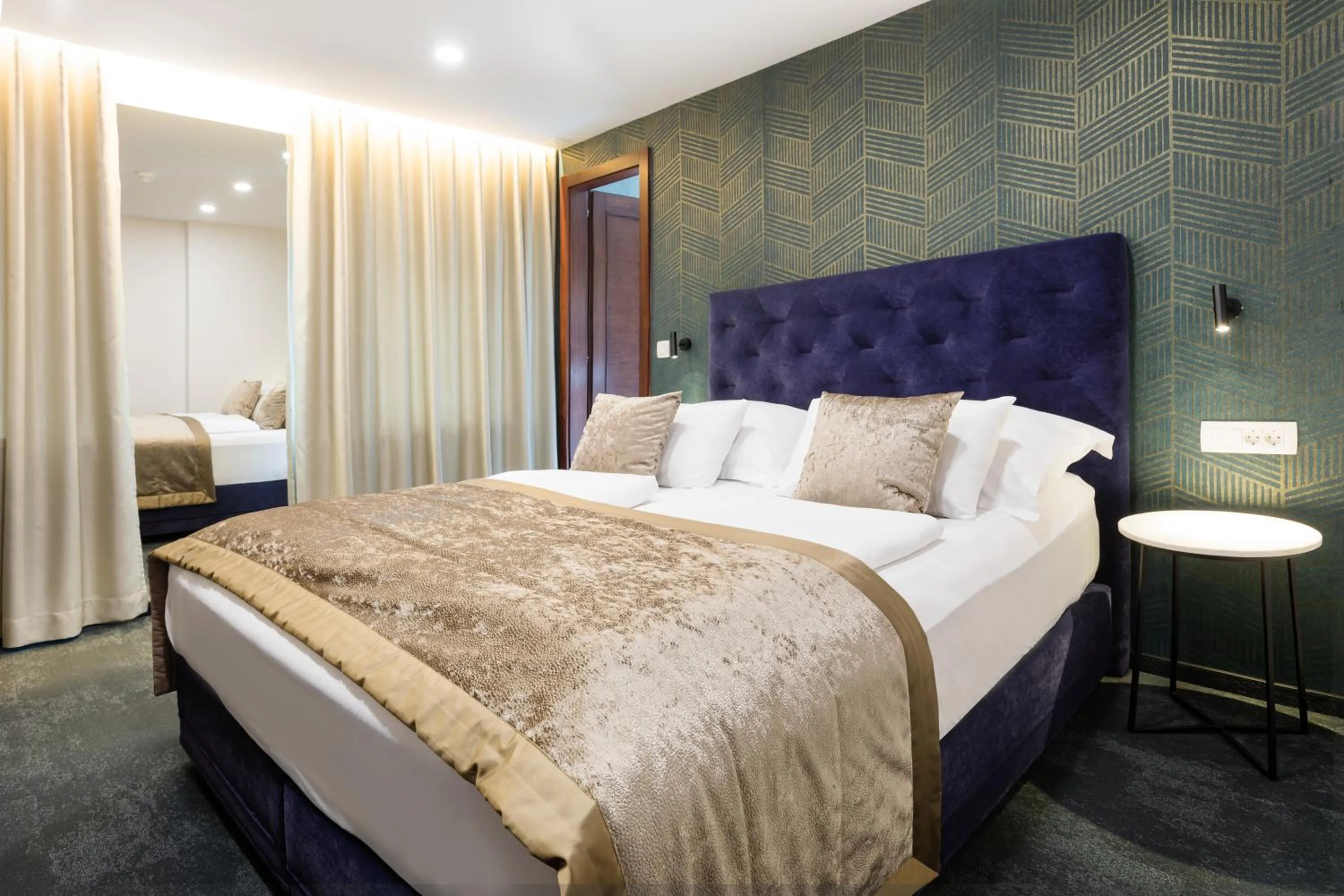 Bed in Garni Hotel Cirman