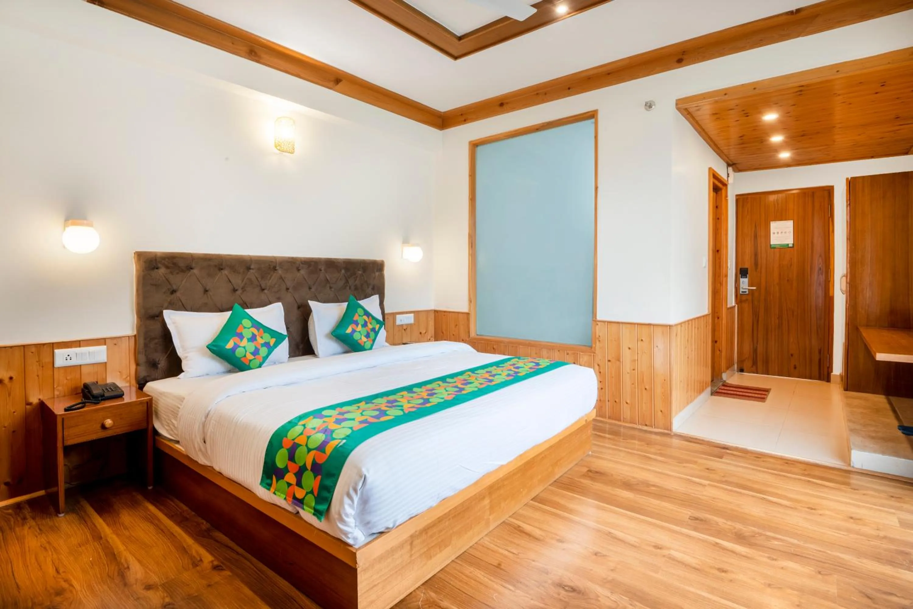 Bedroom, Bed in Treebo Premium Sattva With Mountain View