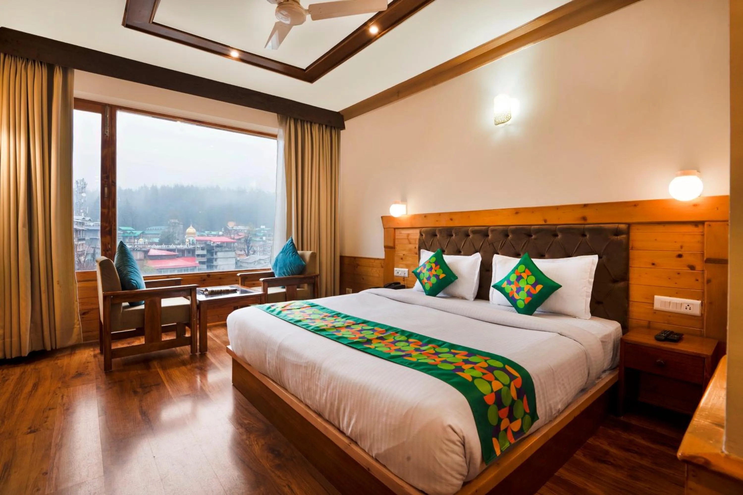 Bedroom, Bed in Treebo Premium Sattva With Mountain View