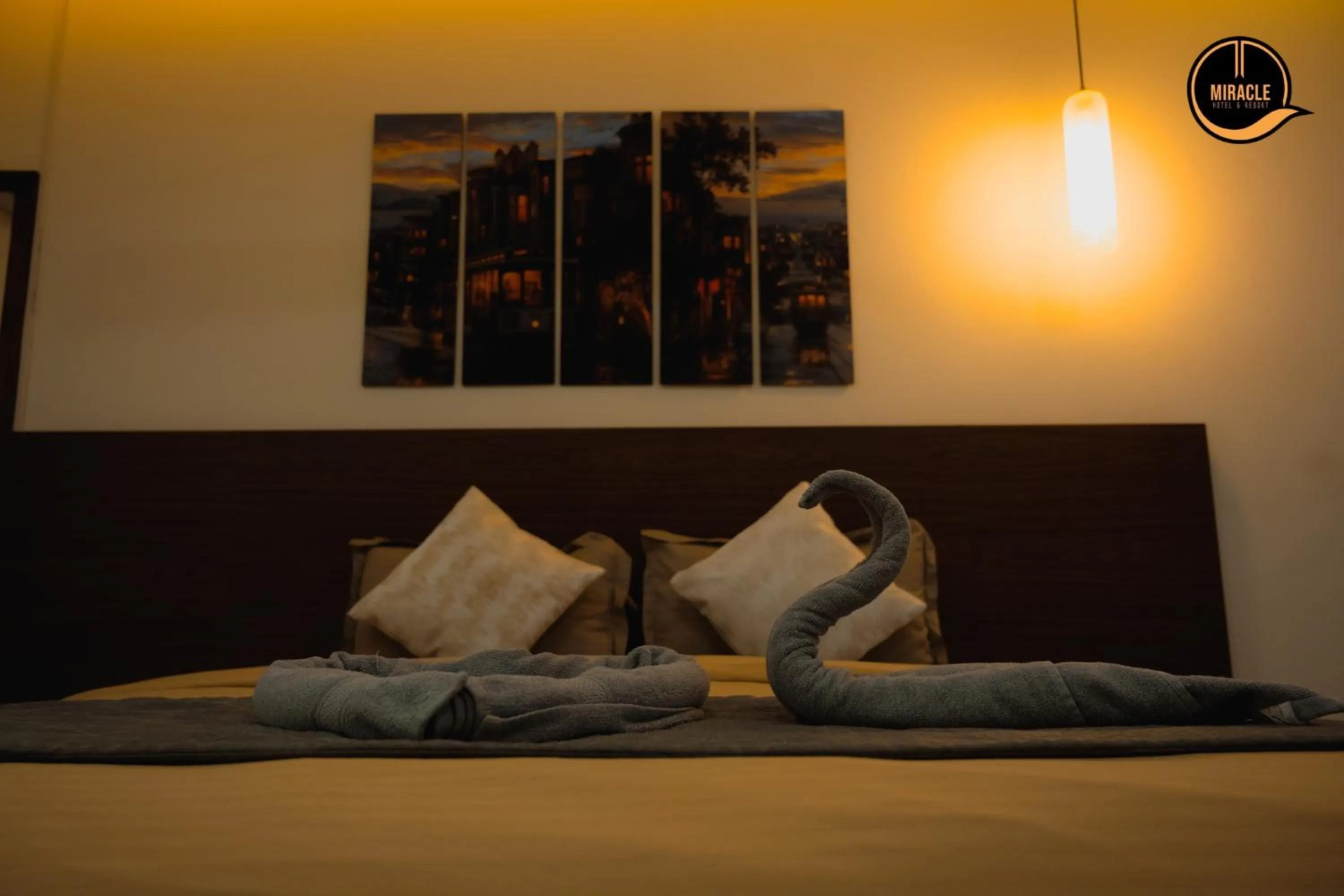 Bed in Miracle Hotel and Resorts