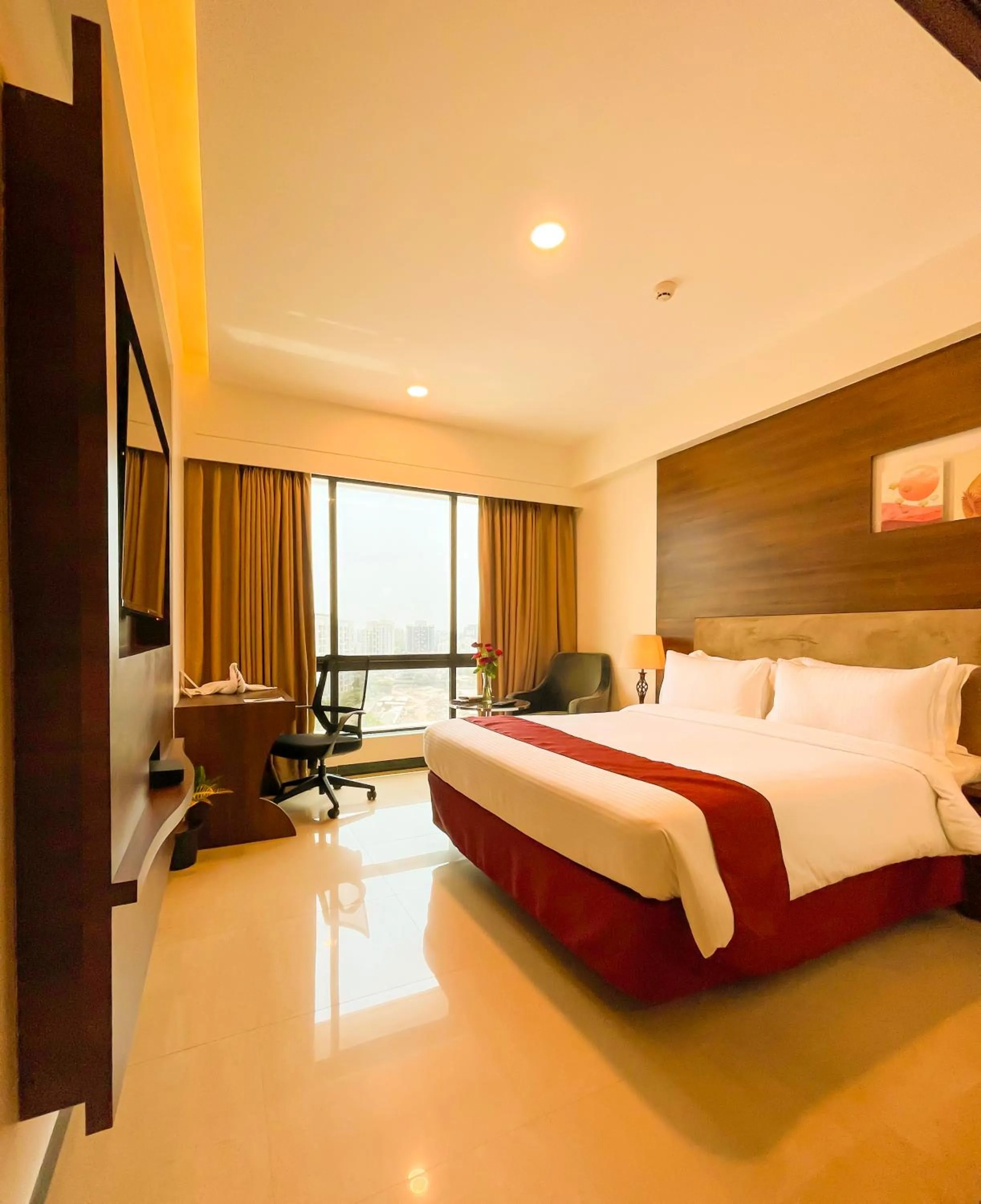 Photo of the whole room, Bed in Hotel Tip Top International Pune