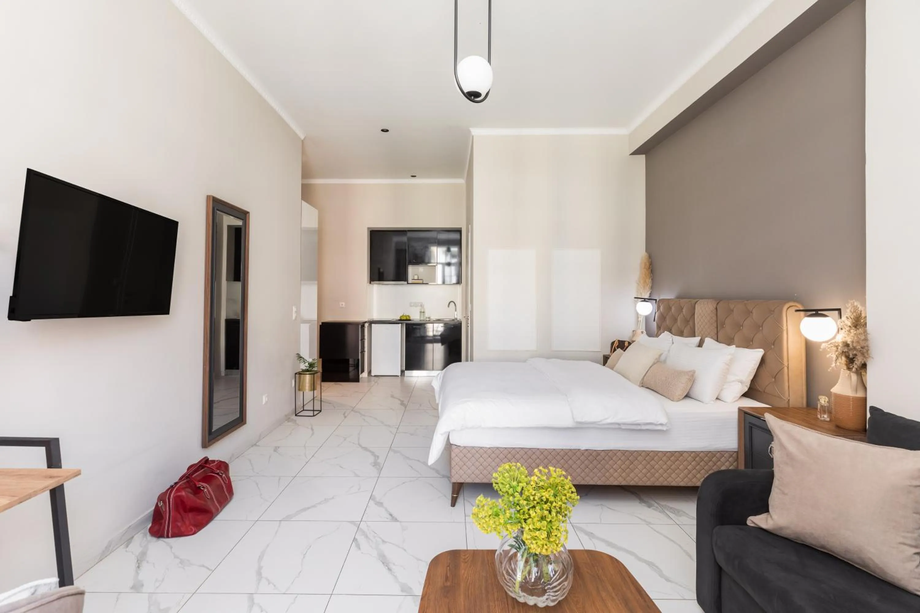 Photo of the whole room, Bed in Black Onyx Comfort Suites - Elegant Stay- City Center Next to Airport Bus