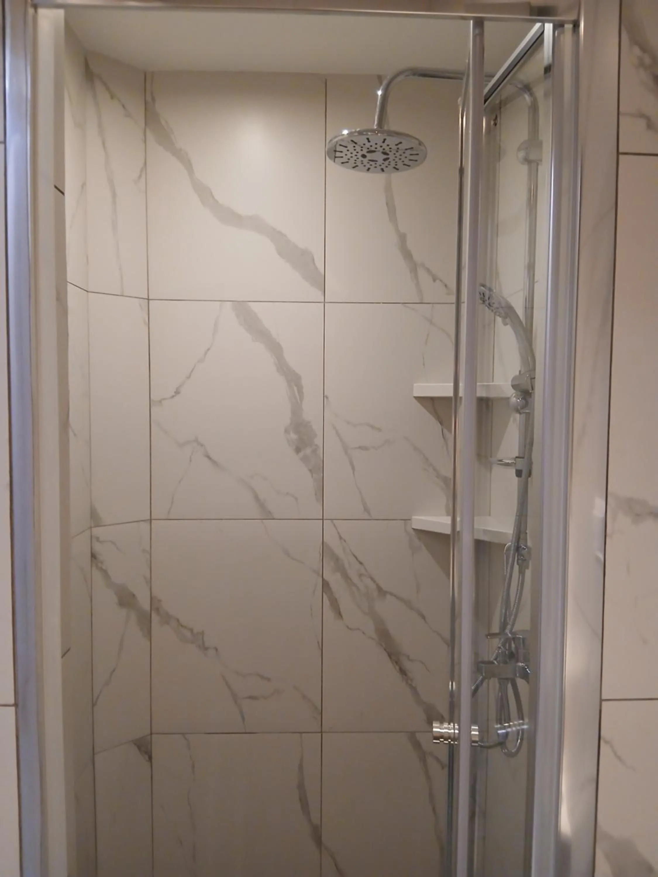 Shower in Black Onyx Comfort Suites - Elegant Stay- City Center Next to Airport Bus