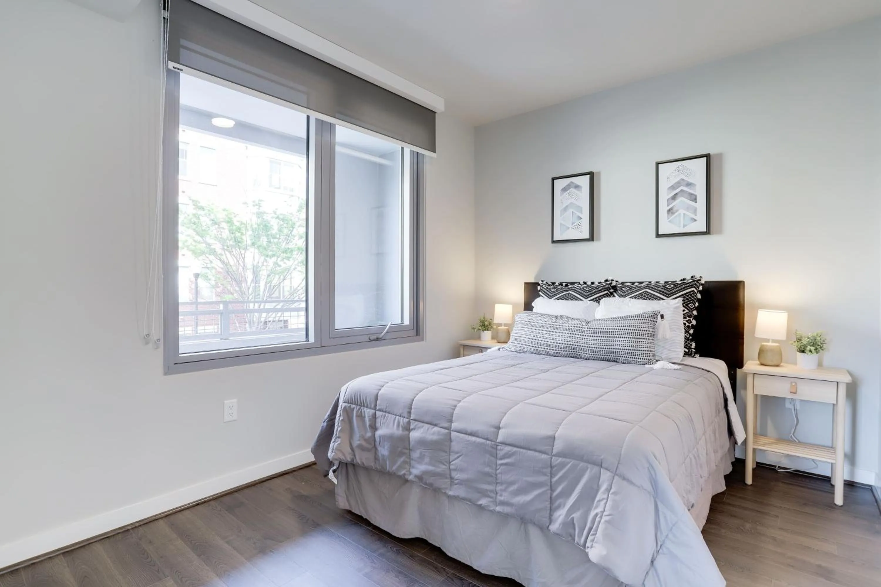 Bed in Stylish Condo at Clarendon with Rooftop Views