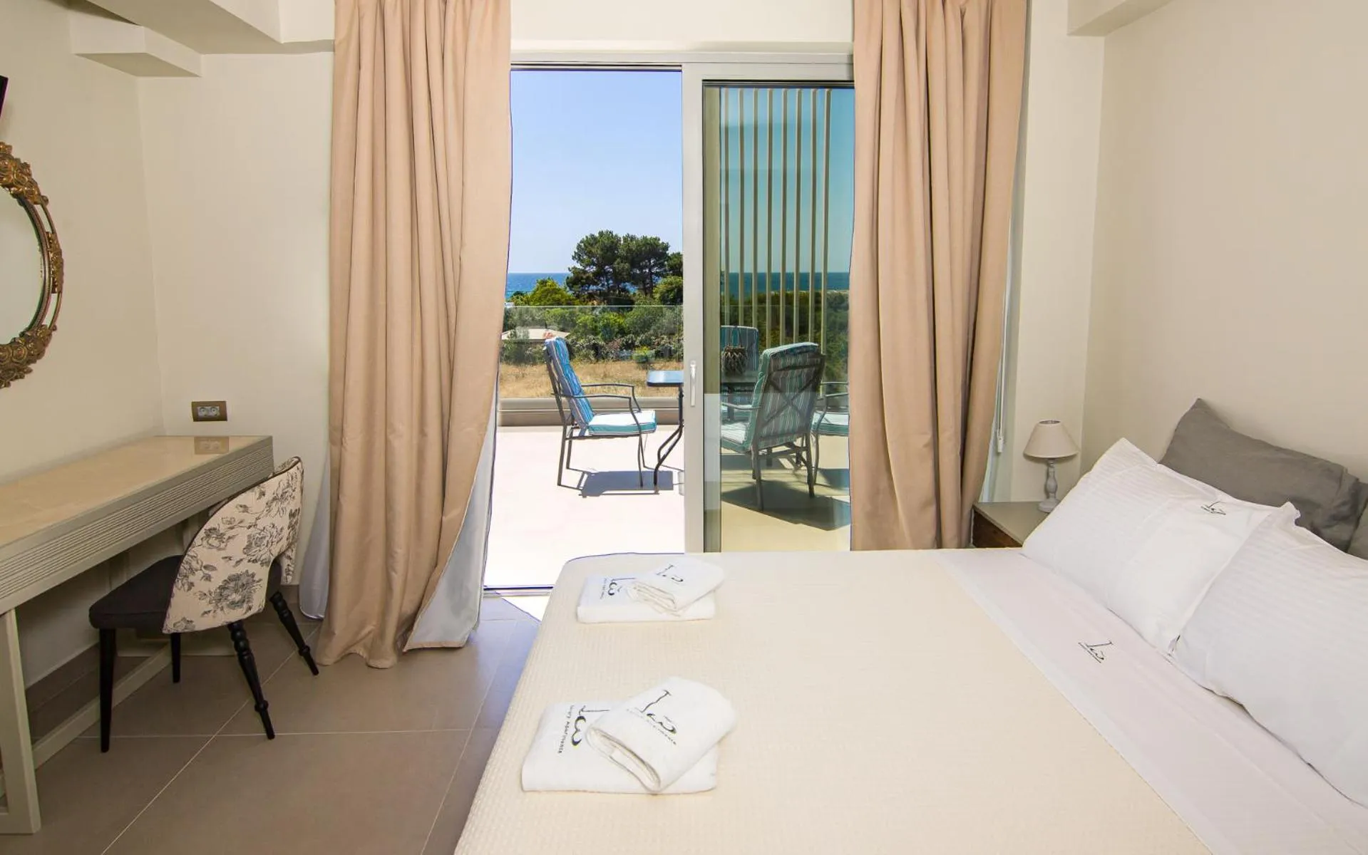 Bed in IO Luxury Pool & Hot Tub Suites