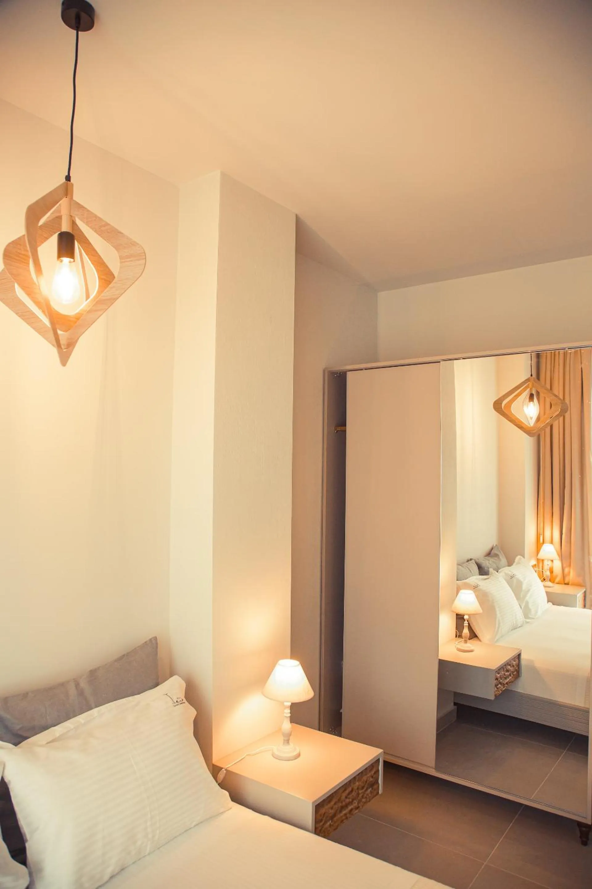 Bed in IO Luxury Pool & Hot Tub Suites