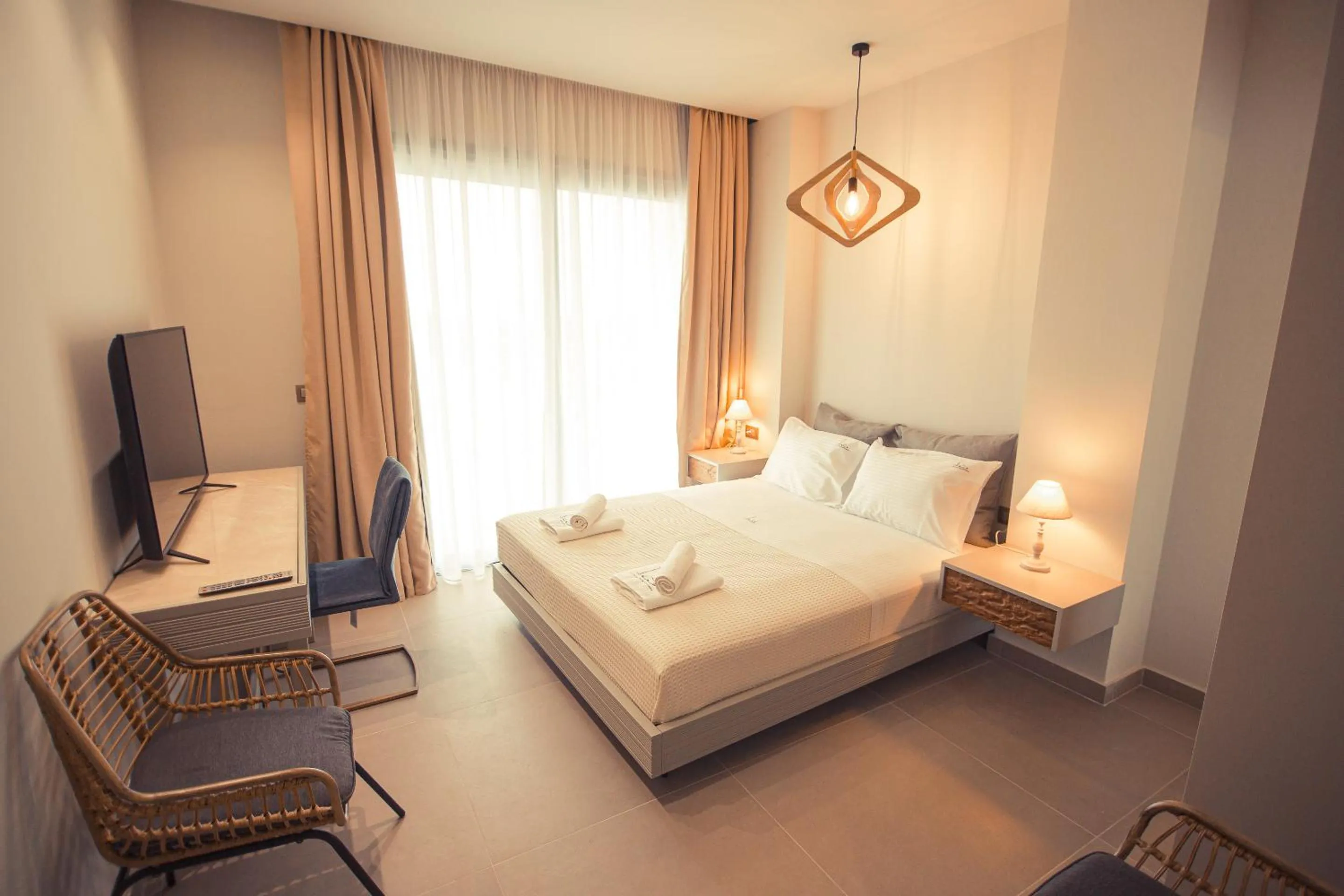 Bed in IO Luxury Pool & Hot Tub Suites