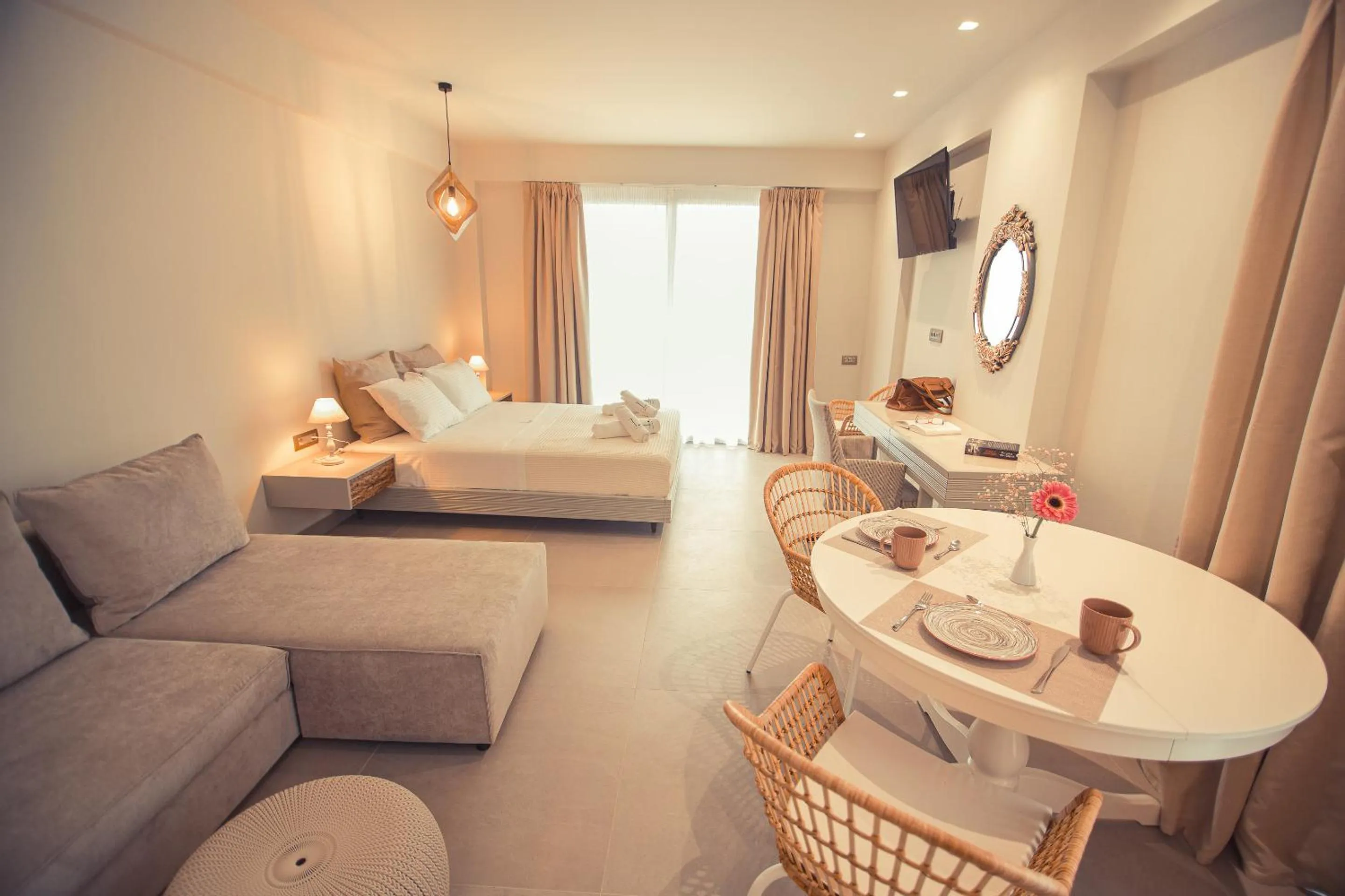 Bed in IO Luxury Pool & Hot Tub Suites