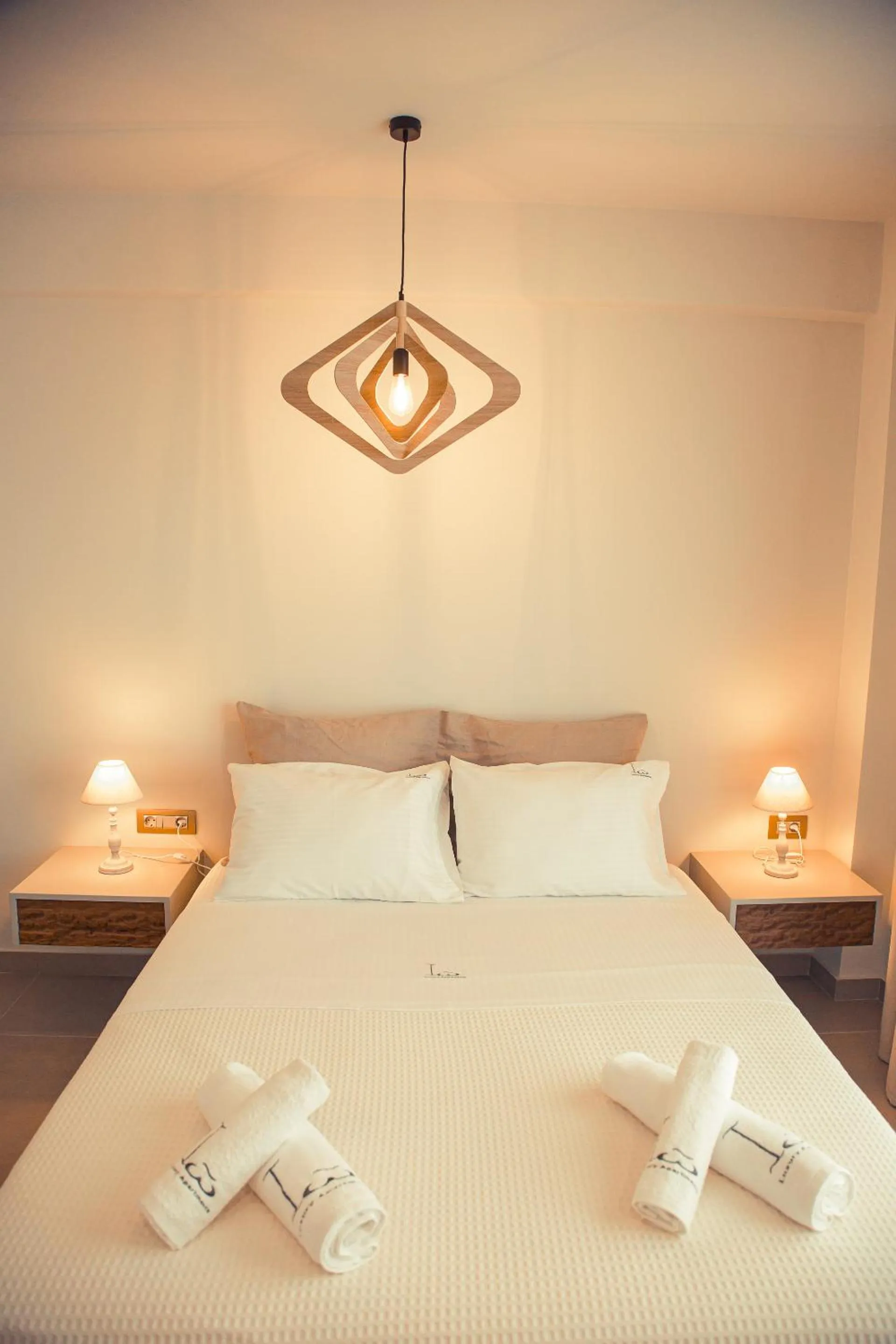 Bedroom in IO Luxury Pool & Hot Tub Suites