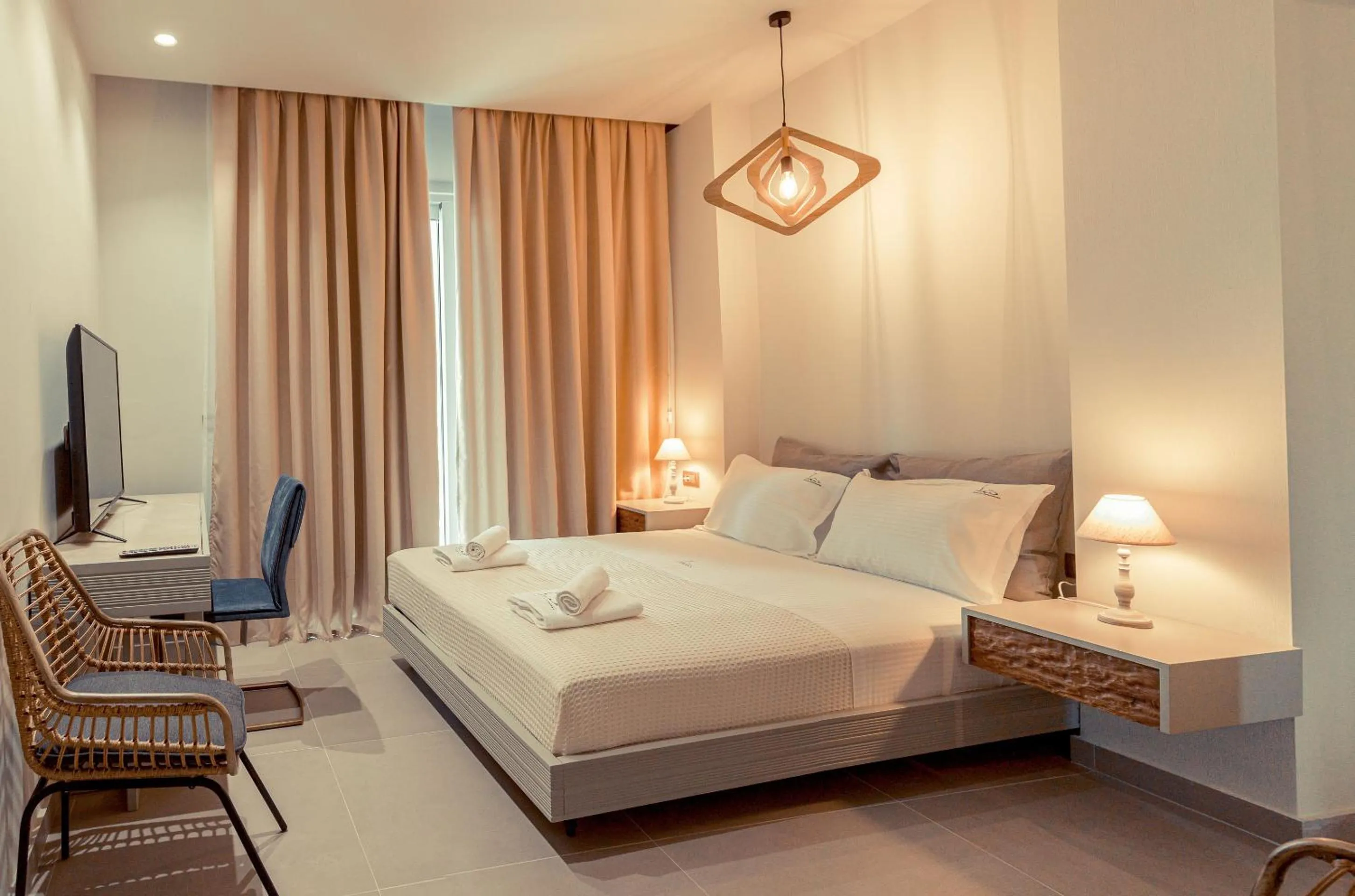 Bed in IO Luxury Pool & Hot Tub Suites