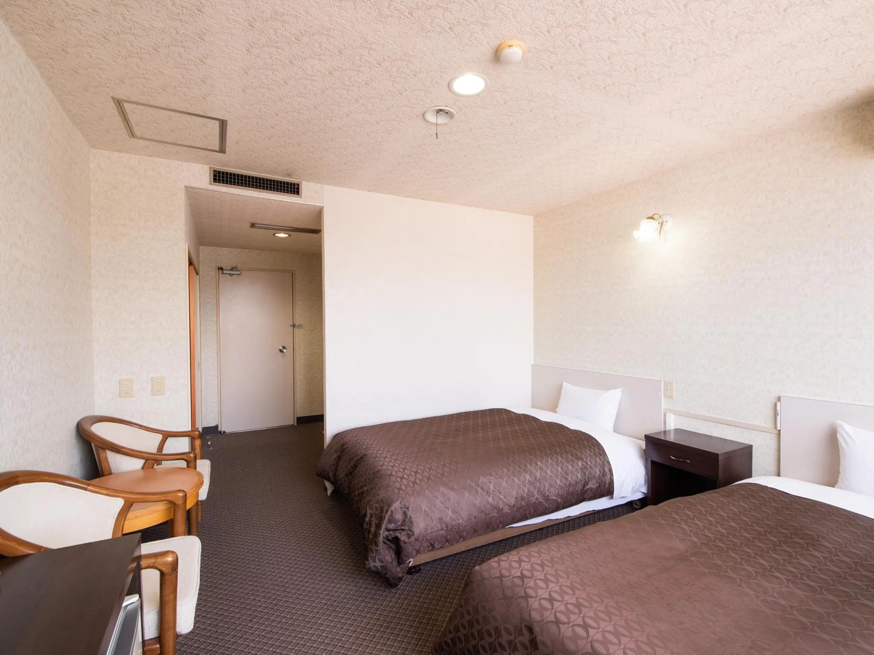 Photo of the whole room, Bed in Hotel Primrose Saito