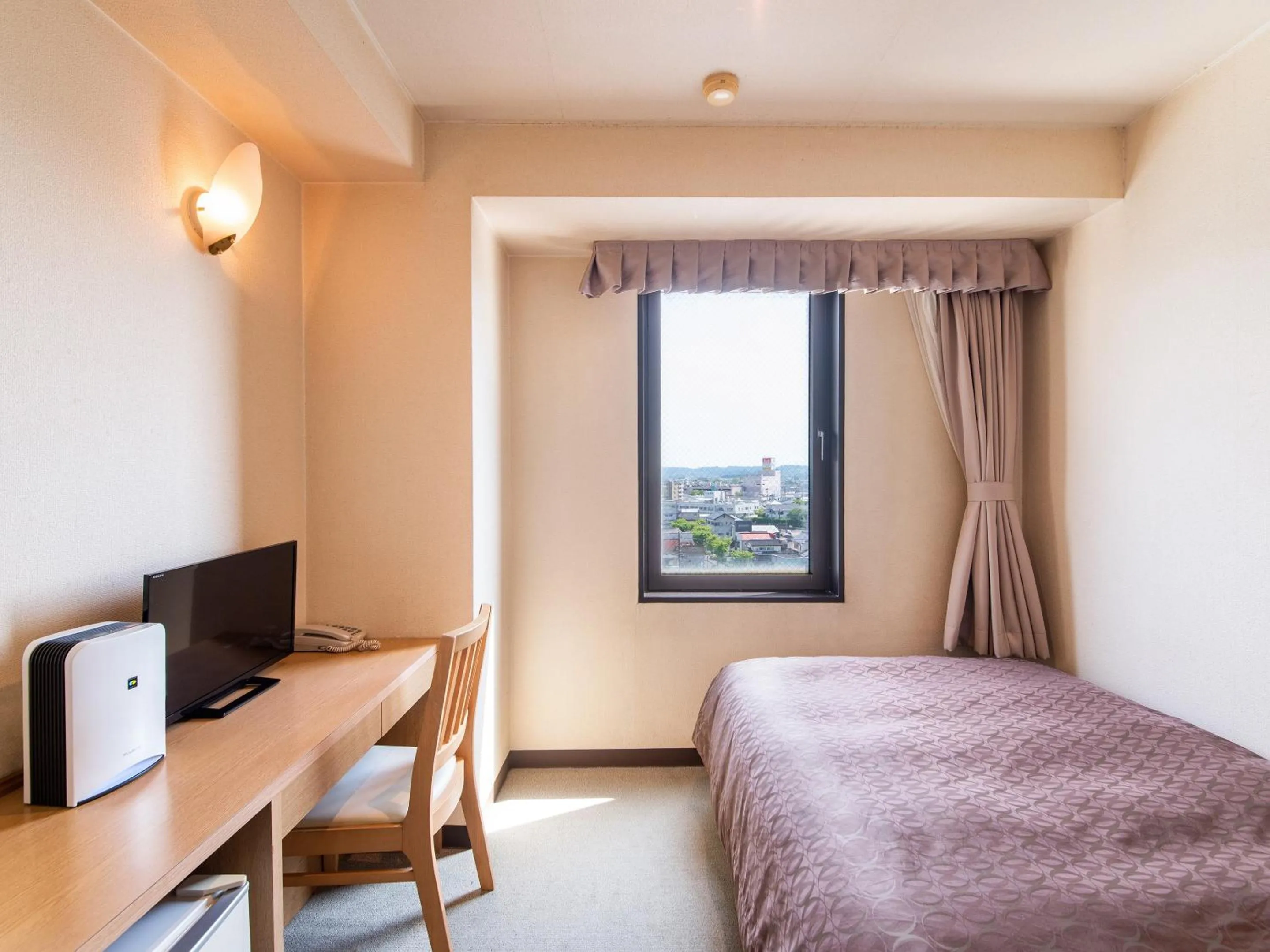 Photo of the whole room, Bed in Hotel Primrose Saito