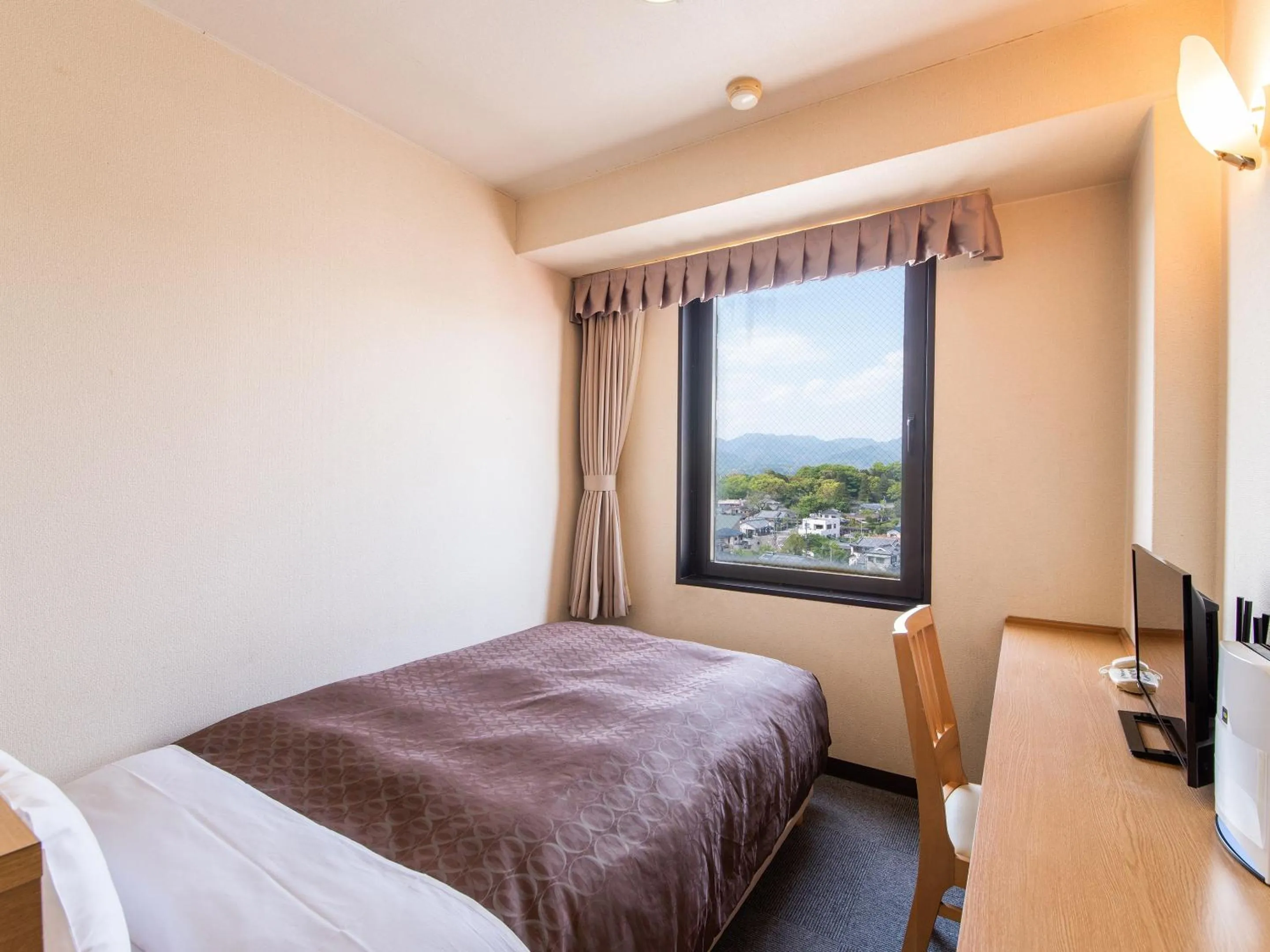 Photo of the whole room, Bed in Hotel Primrose Saito