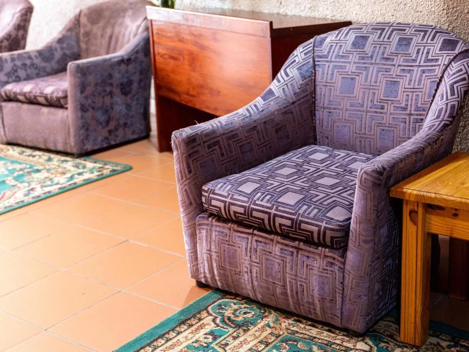 Communal lounge/ TV room in Ngwenya City Hotel