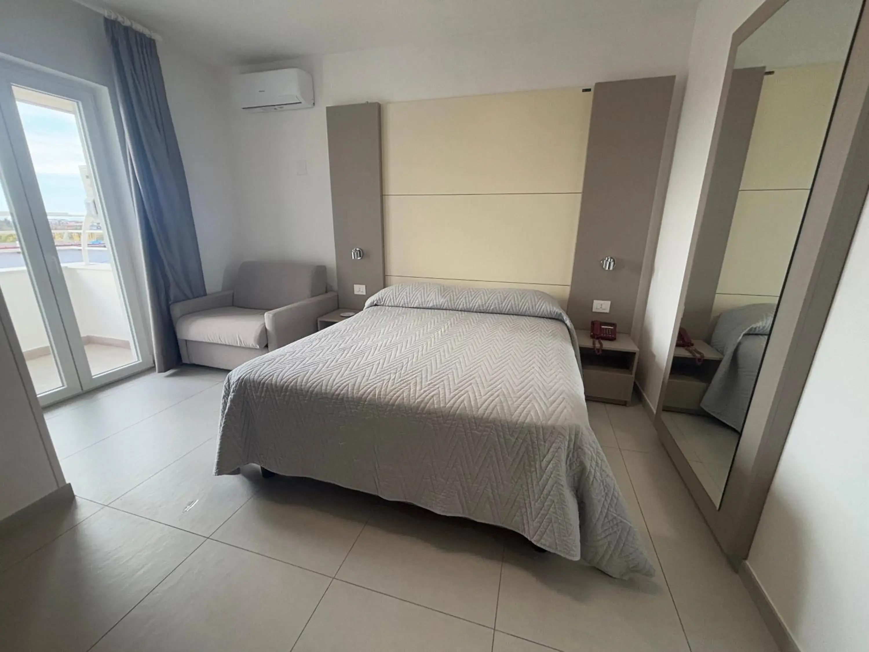 Photo of the whole room, Bed in Hotel La Mela Photo of the whole room, Bed in Hotel La Mela