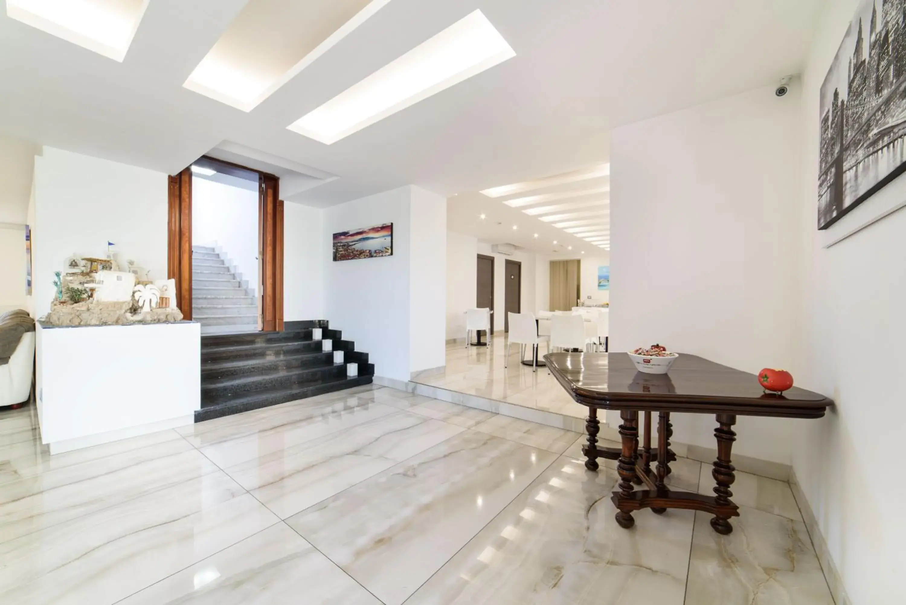 Lobby or reception in Hotel La Mela Lobby or reception in Hotel La Mela