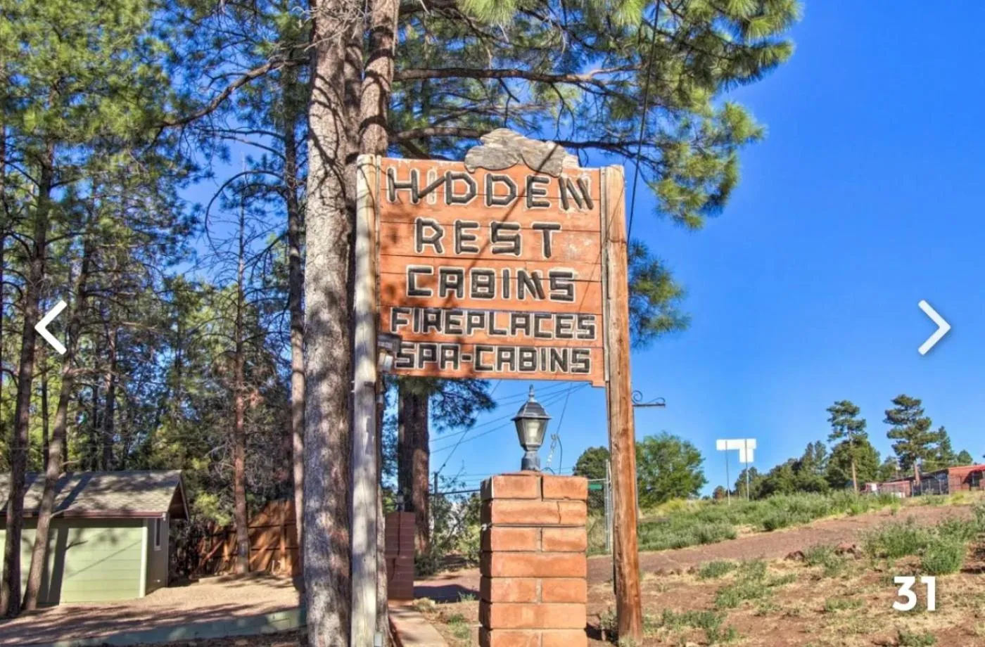 Property logo or sign in Hidden Rest Cabins and Resort