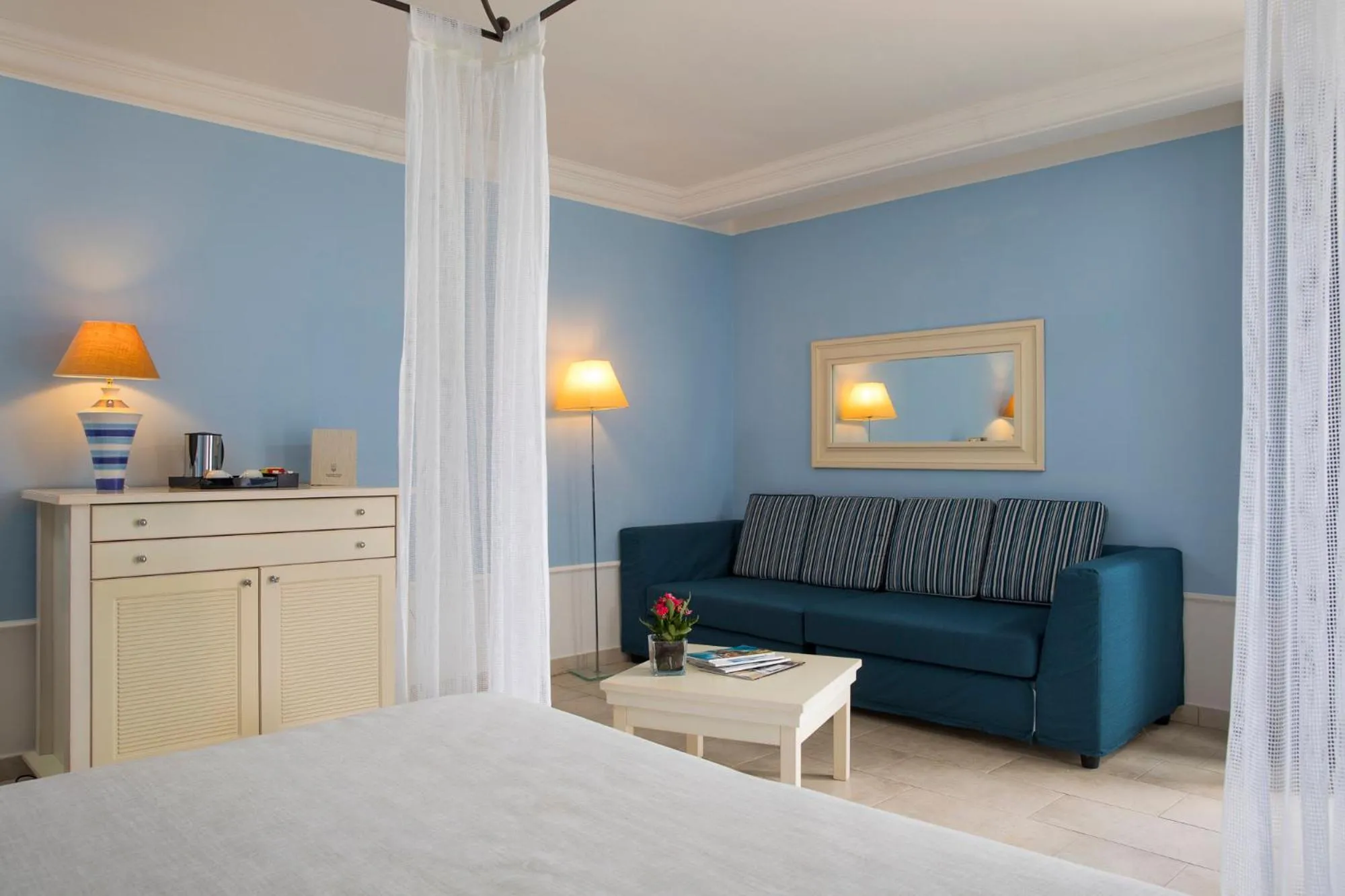 Seating area, Bed in Lu' Hotel Riviera - Carloforte