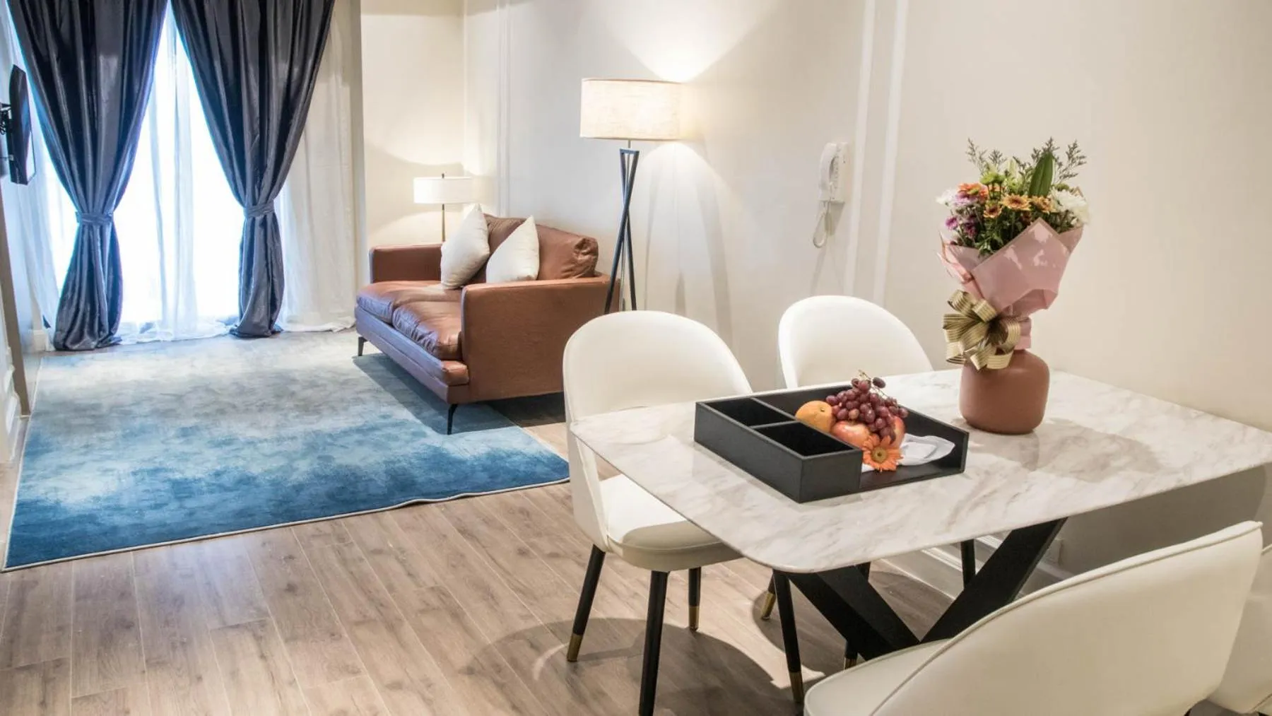 Living room, Bed in Noble Cebu Hotel