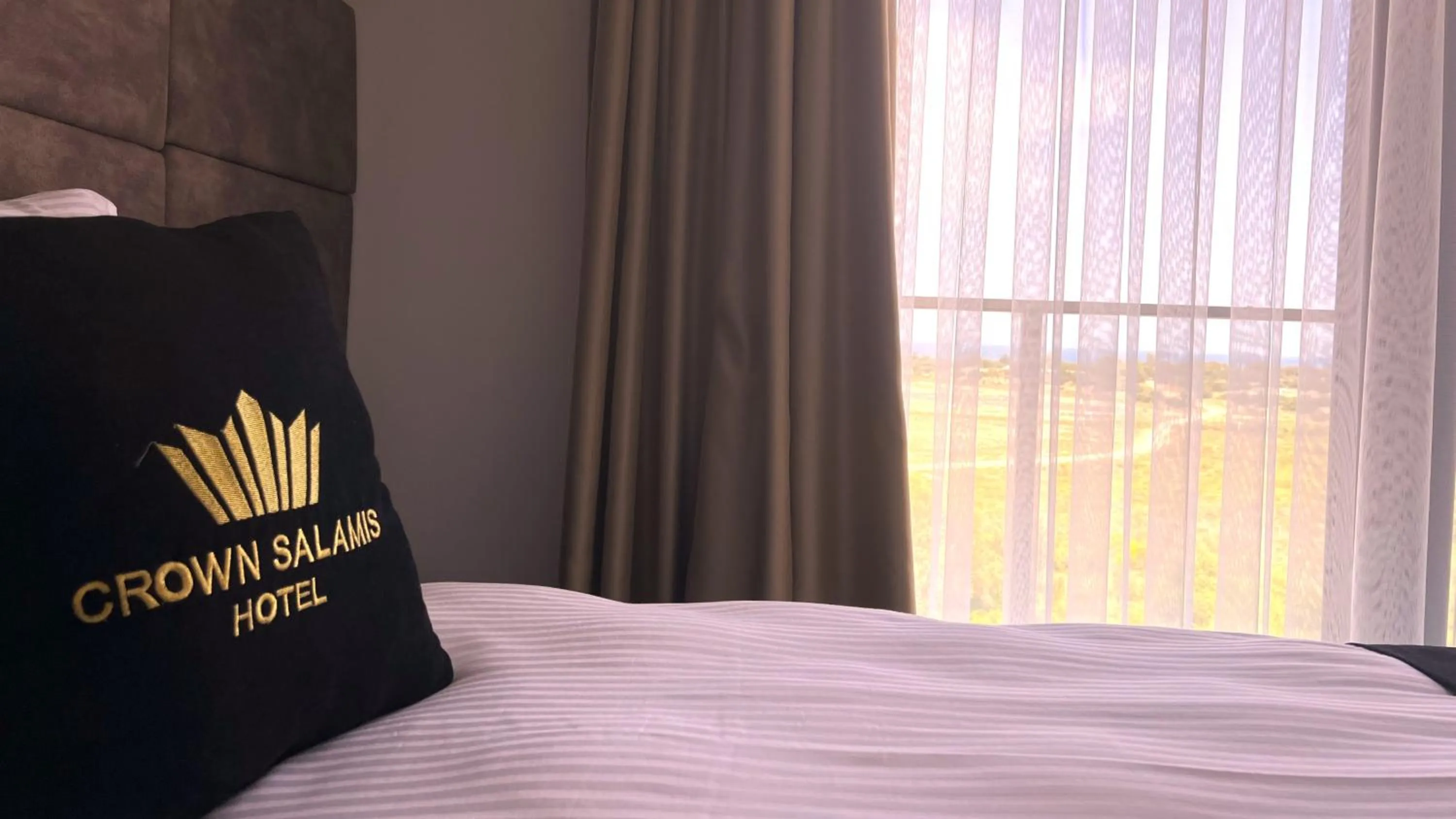 Bed in Crown Salamis Hotel