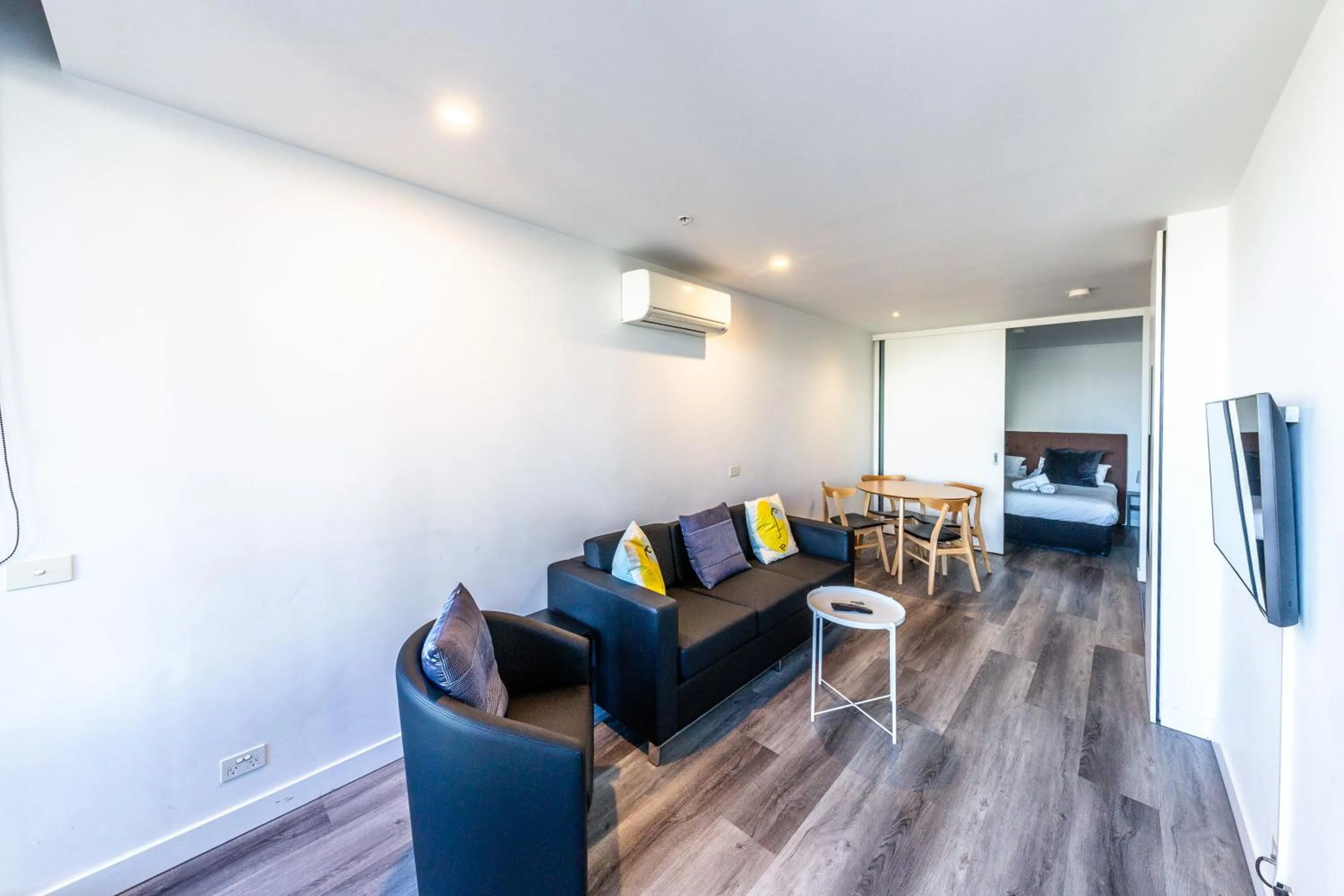 Living room in Aura2107, CBD Entire 2 Bedroom Apartment with Balcony and Stunning Yarra River Views