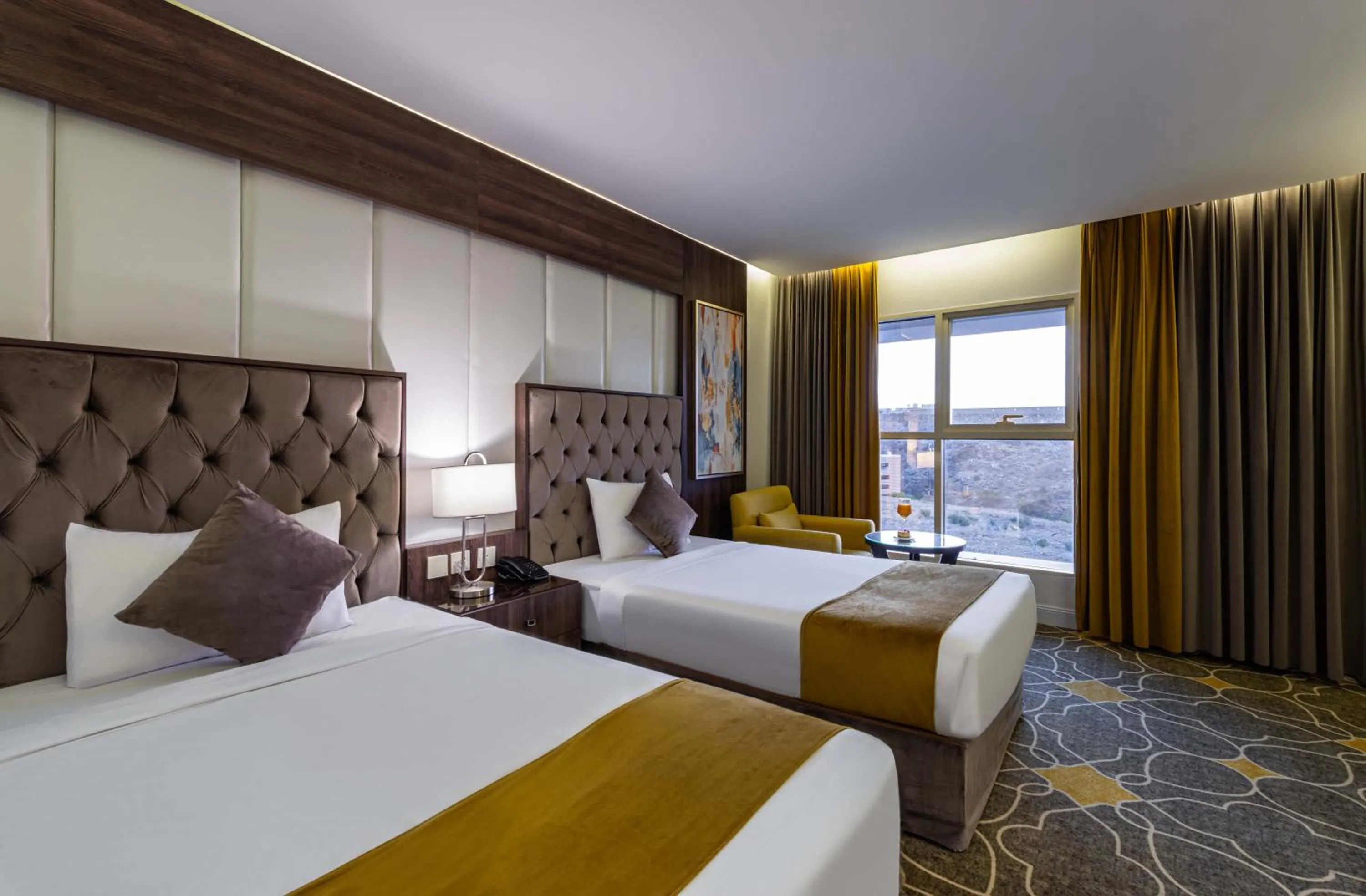 Bed in Abha Gardn Millennium Hotel