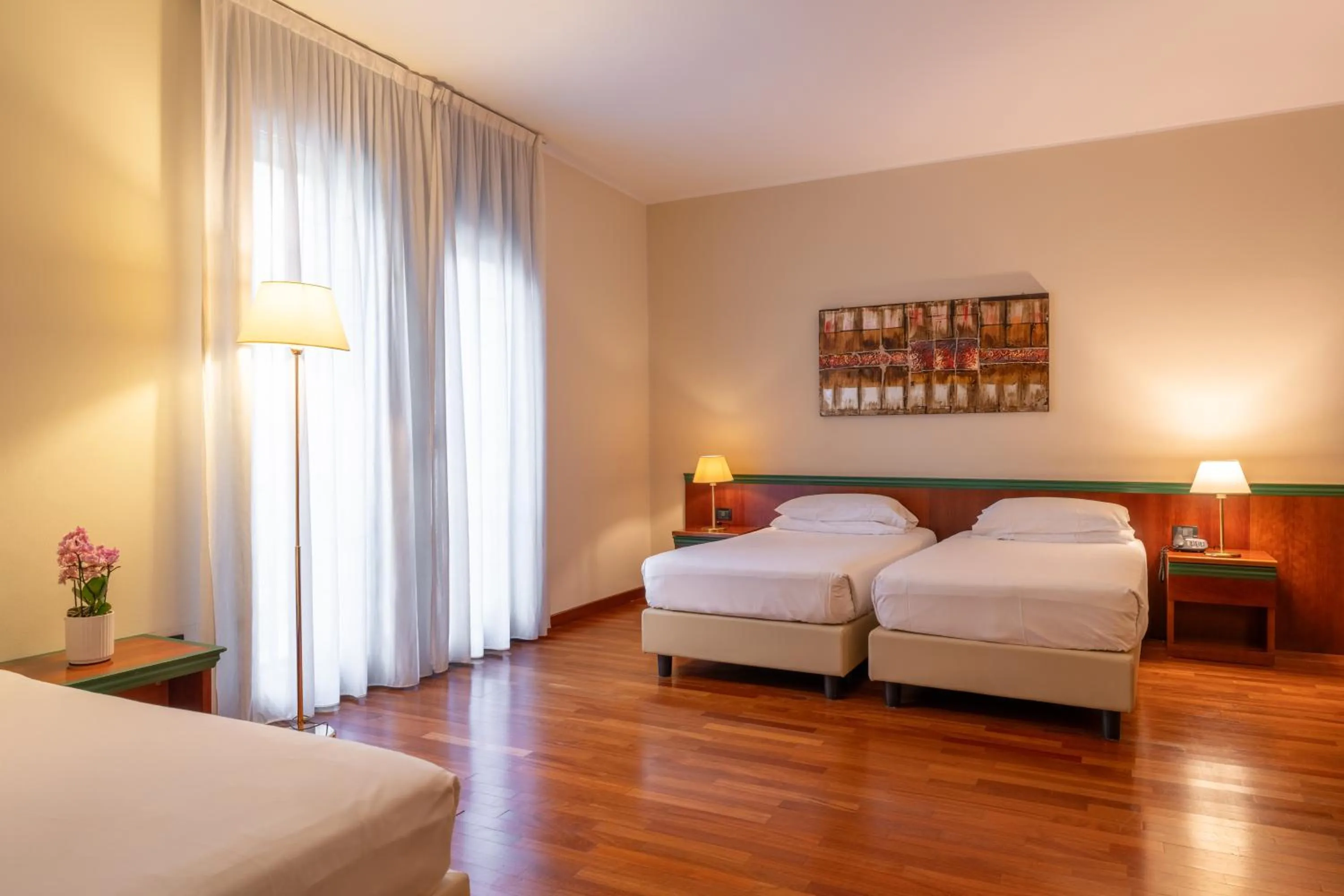 Seating area, Bed in Hotel Raffaello
