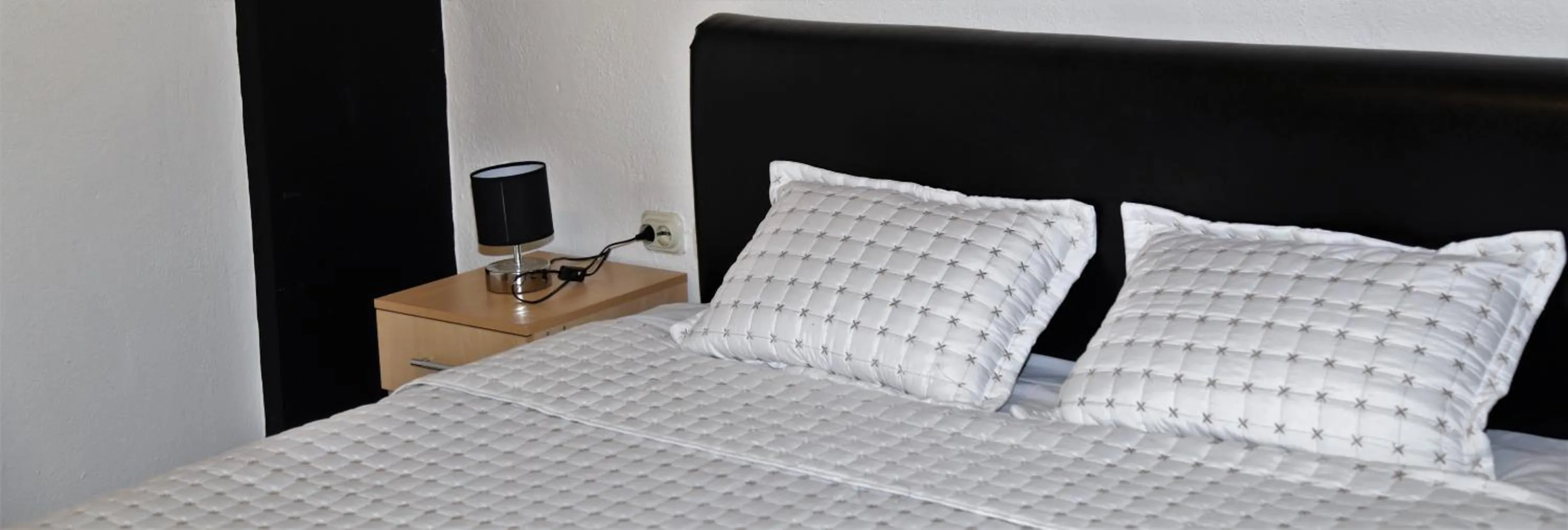 Bed in Hotel Ambasador