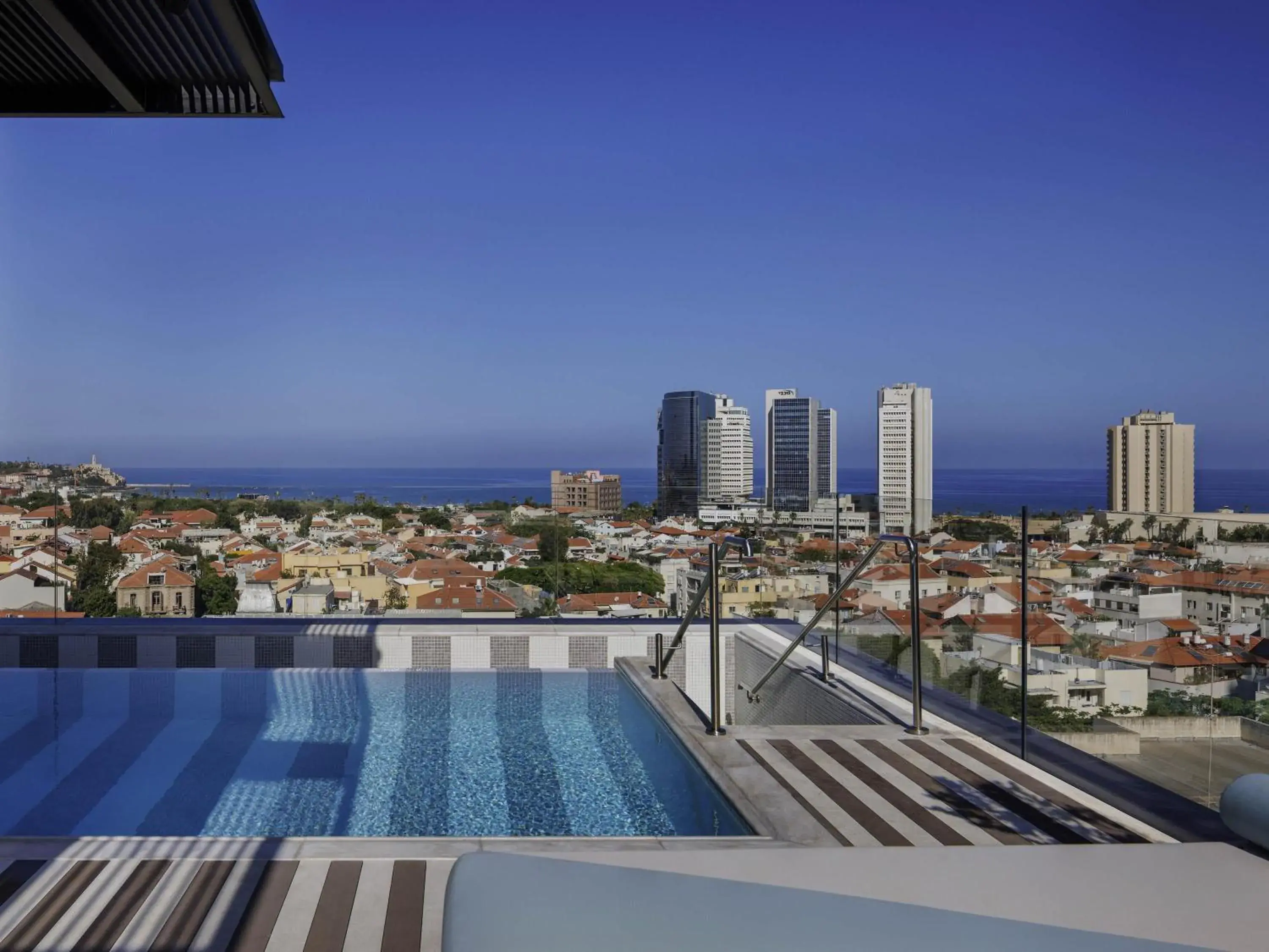 Pool view in Elkonin Tel Aviv - MGallery Hotel Collection Pool view in Elkonin Tel Aviv - MGallery Hotel Collection