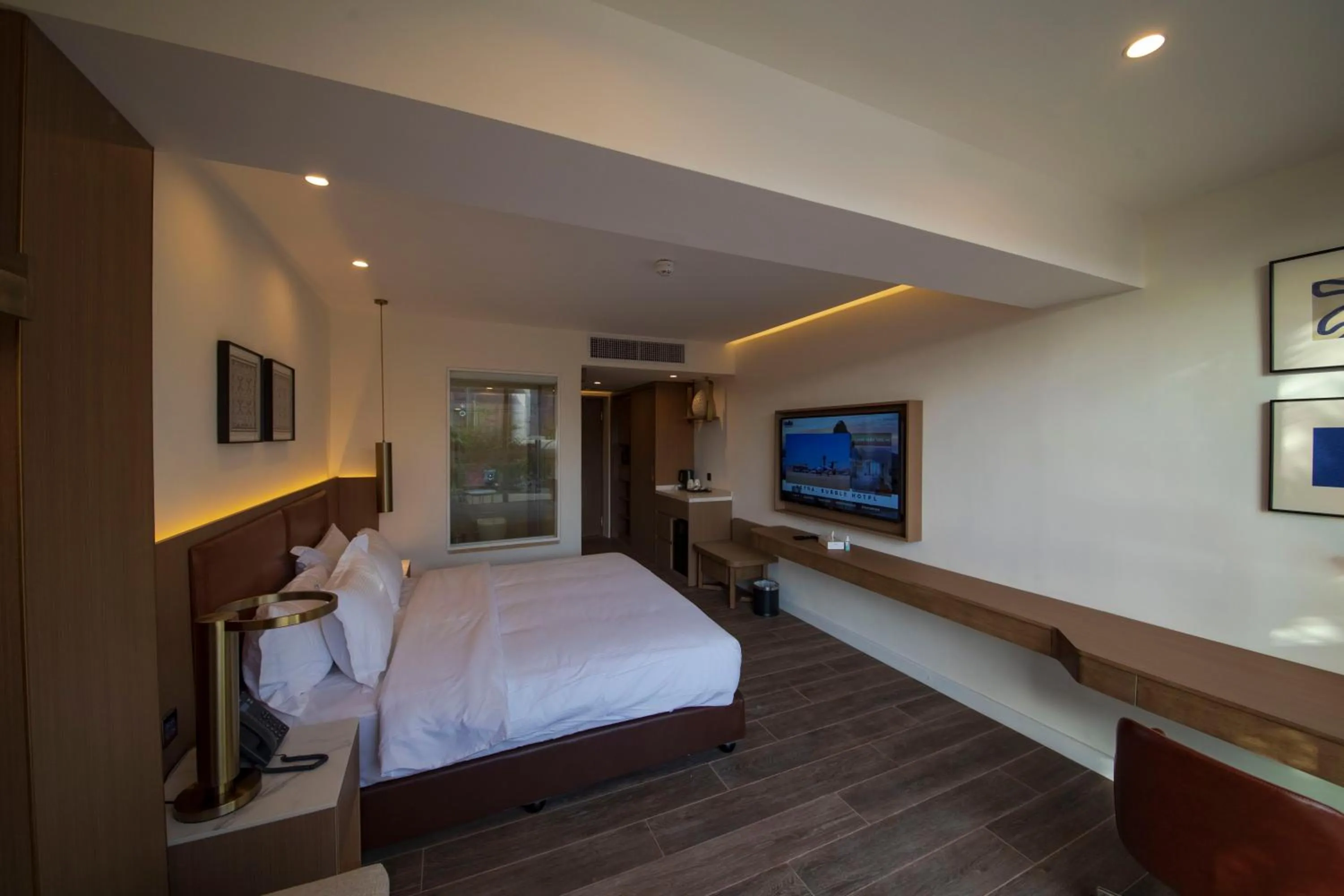 Photo of the whole room, Bed in Luxotel Aqaba Beach Resort & Spa Only 15 years plus