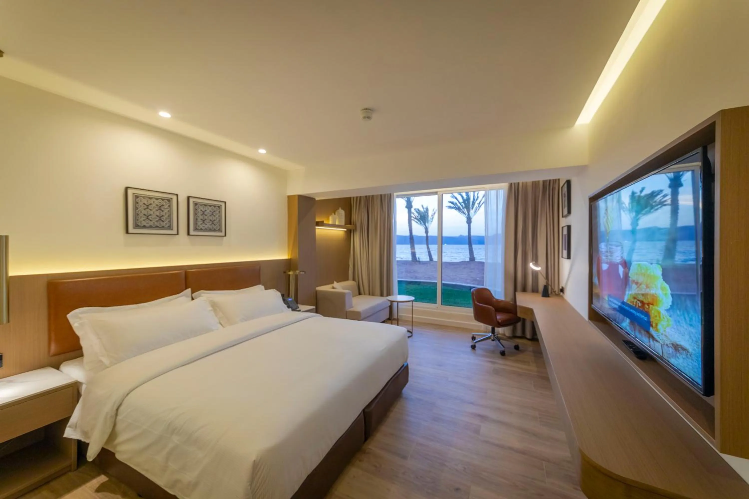 Photo of the whole room, Bed in Luxotel Aqaba Beach Resort & Spa Only 15 years plus