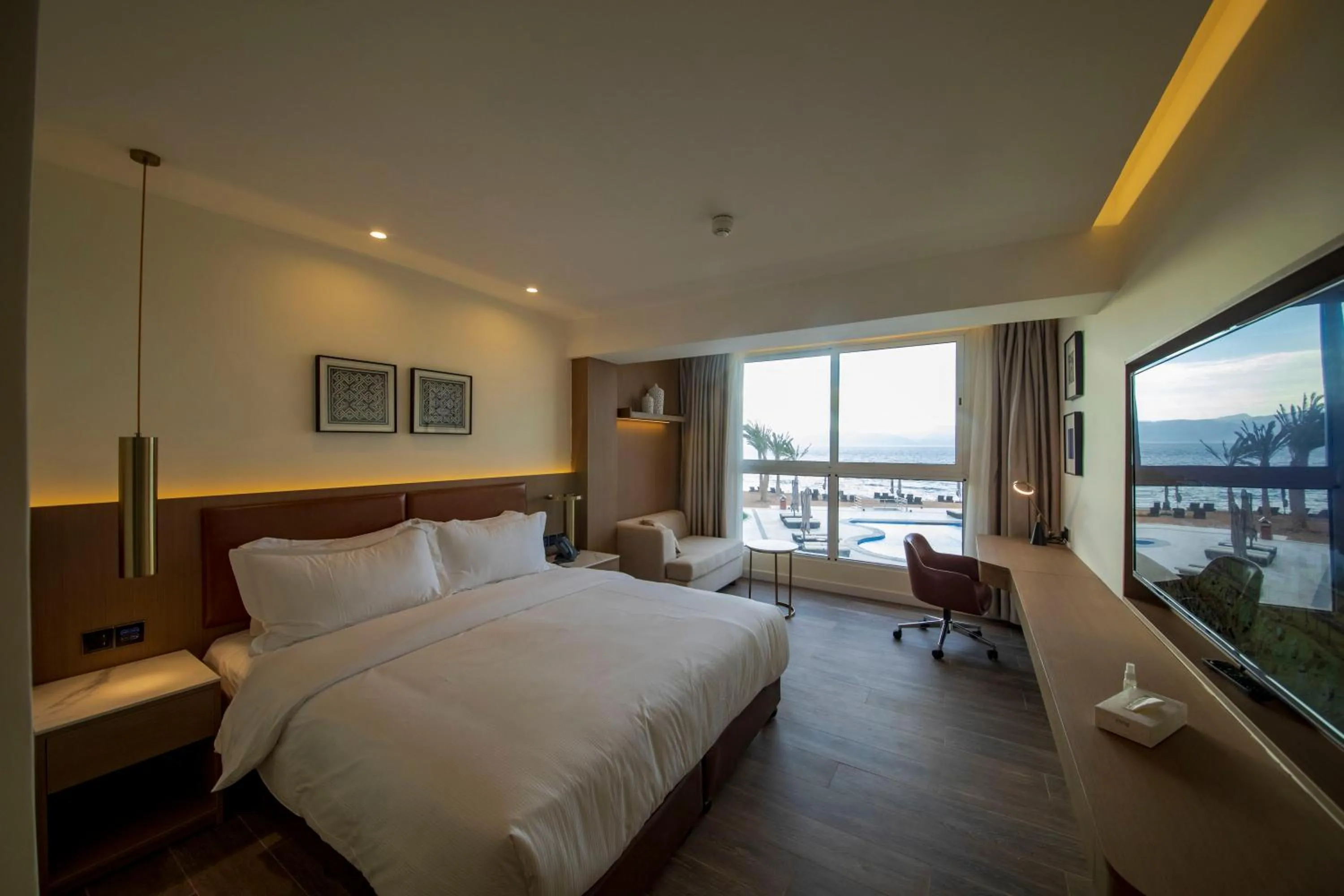 Photo of the whole room, Bed in Luxotel Aqaba Beach Resort & Spa Only 15 years plus