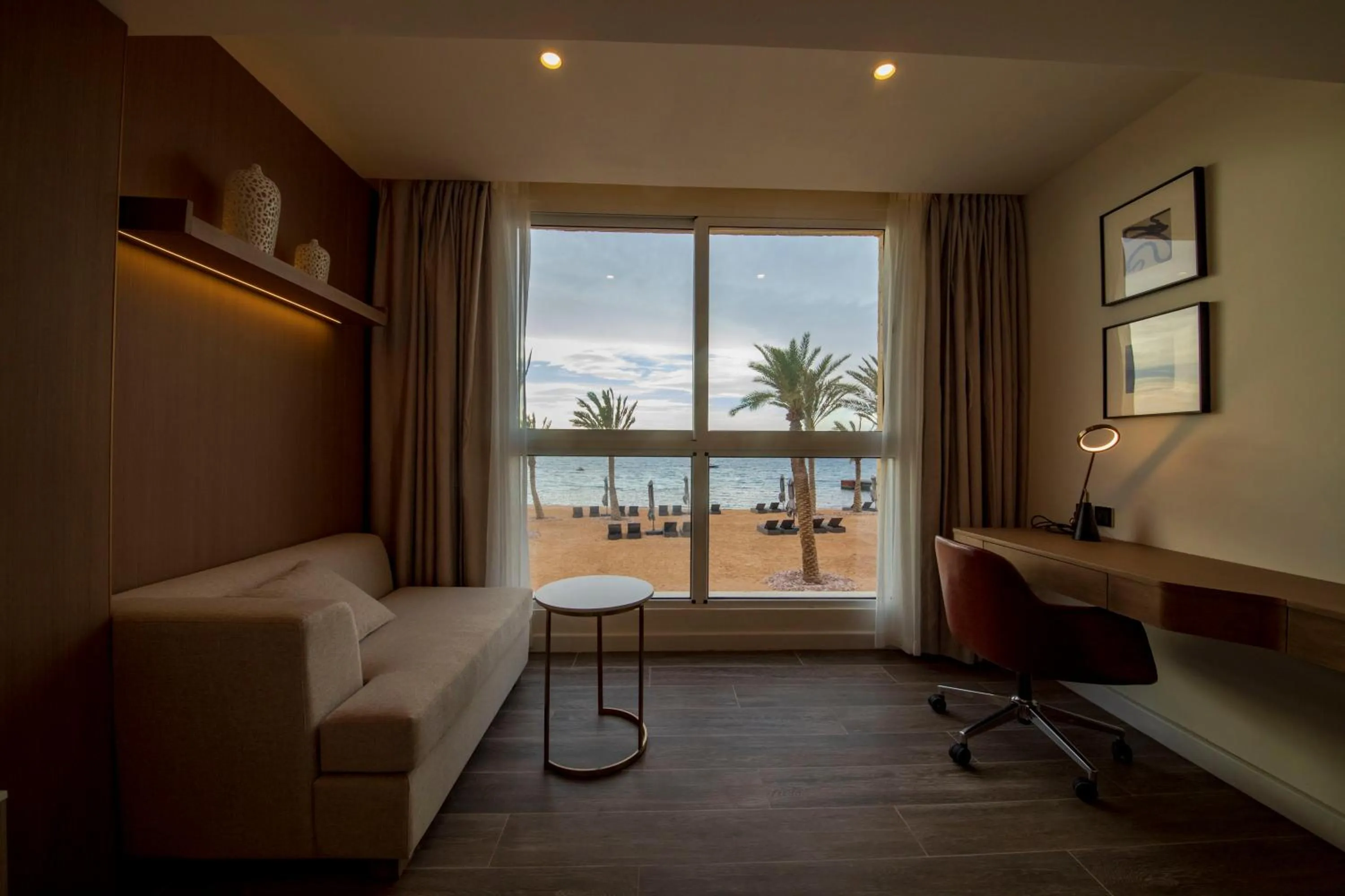 Seating area, Bed in Luxotel Aqaba Beach Resort & Spa Only 15 years plus