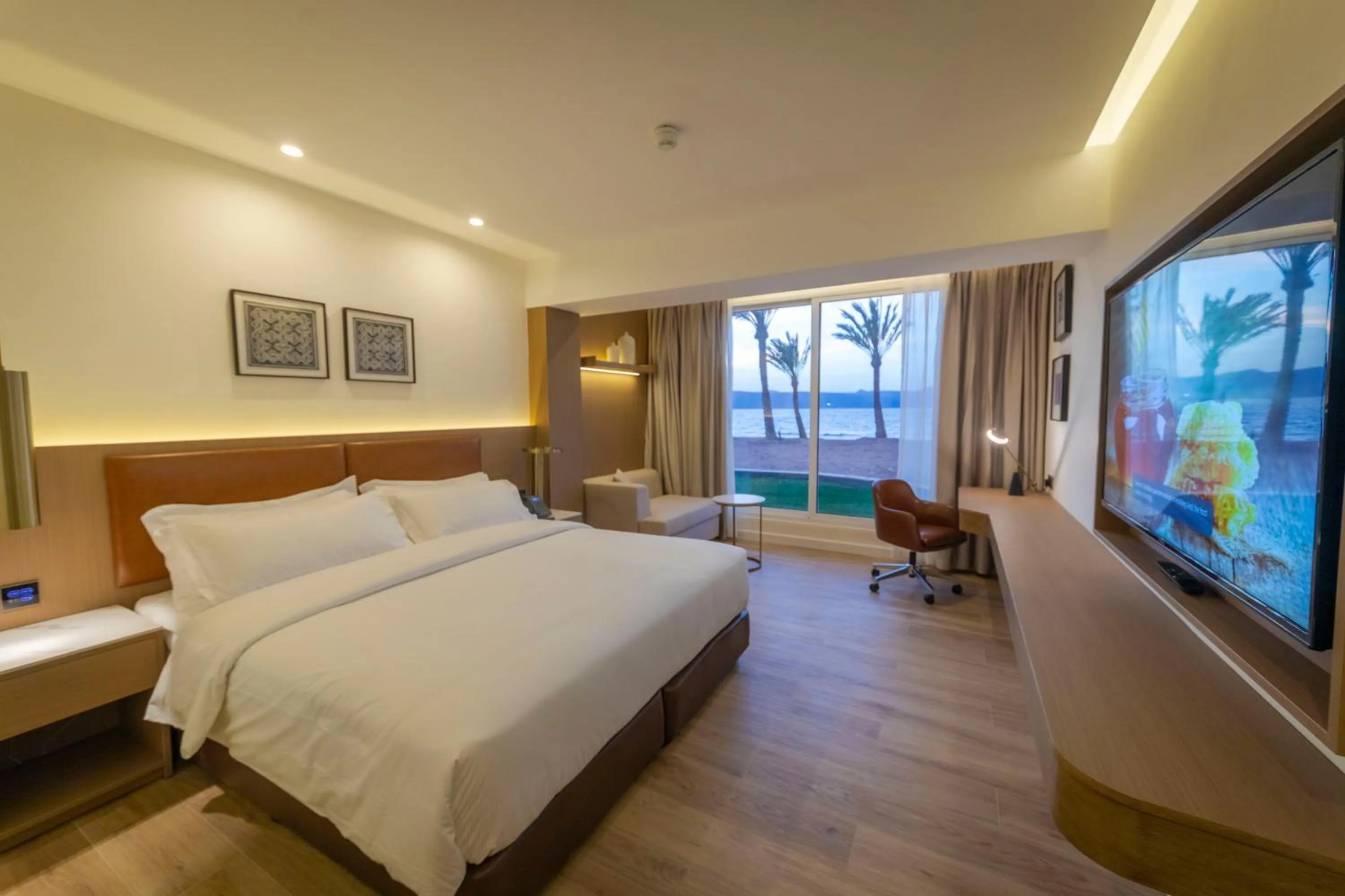 Photo of the whole room, Bed in Luxotel Aqaba Beach Resort & Spa Only 15 years plus