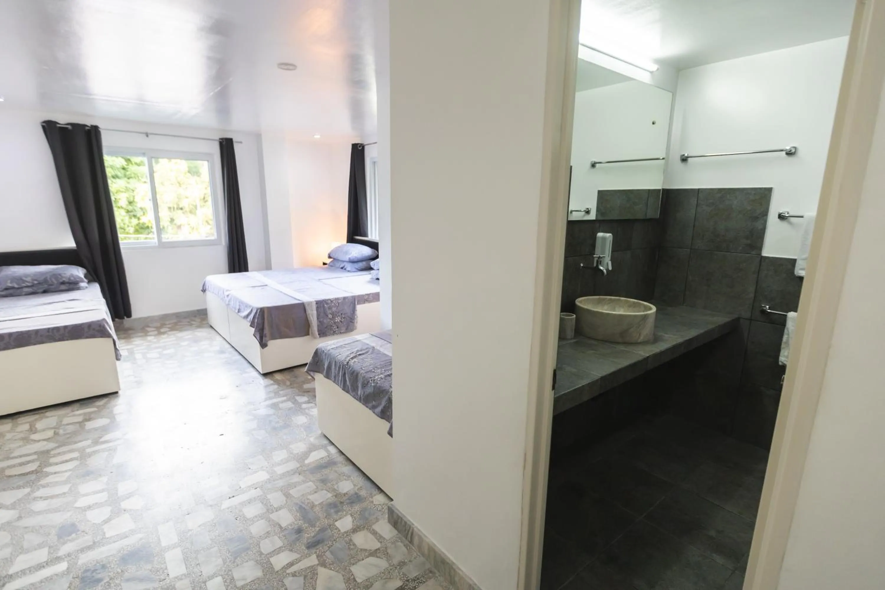 Bathroom, Bed in The Three P Beach Resort & Dive Center