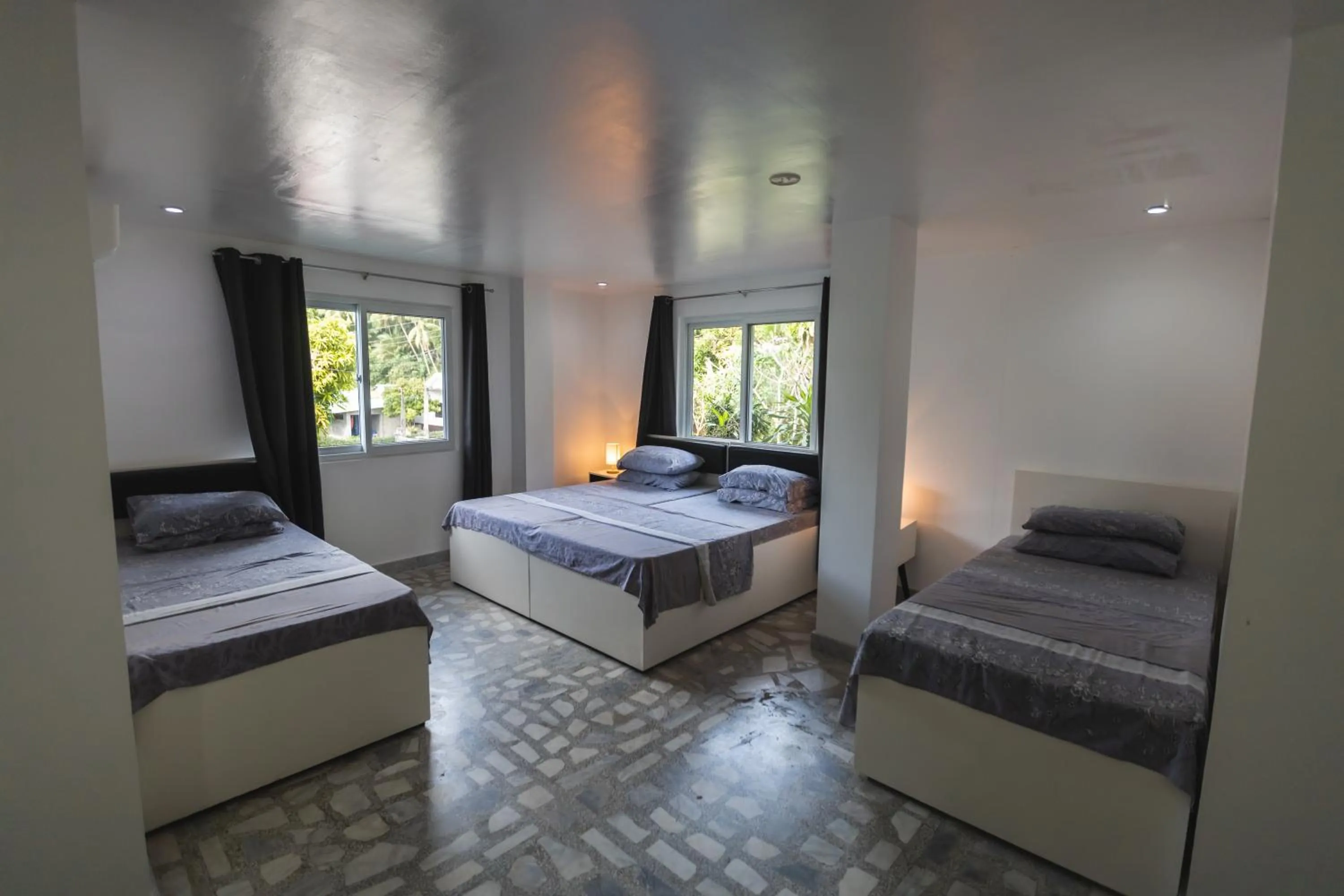 Bed in The Three P Beach Resort & Dive Center