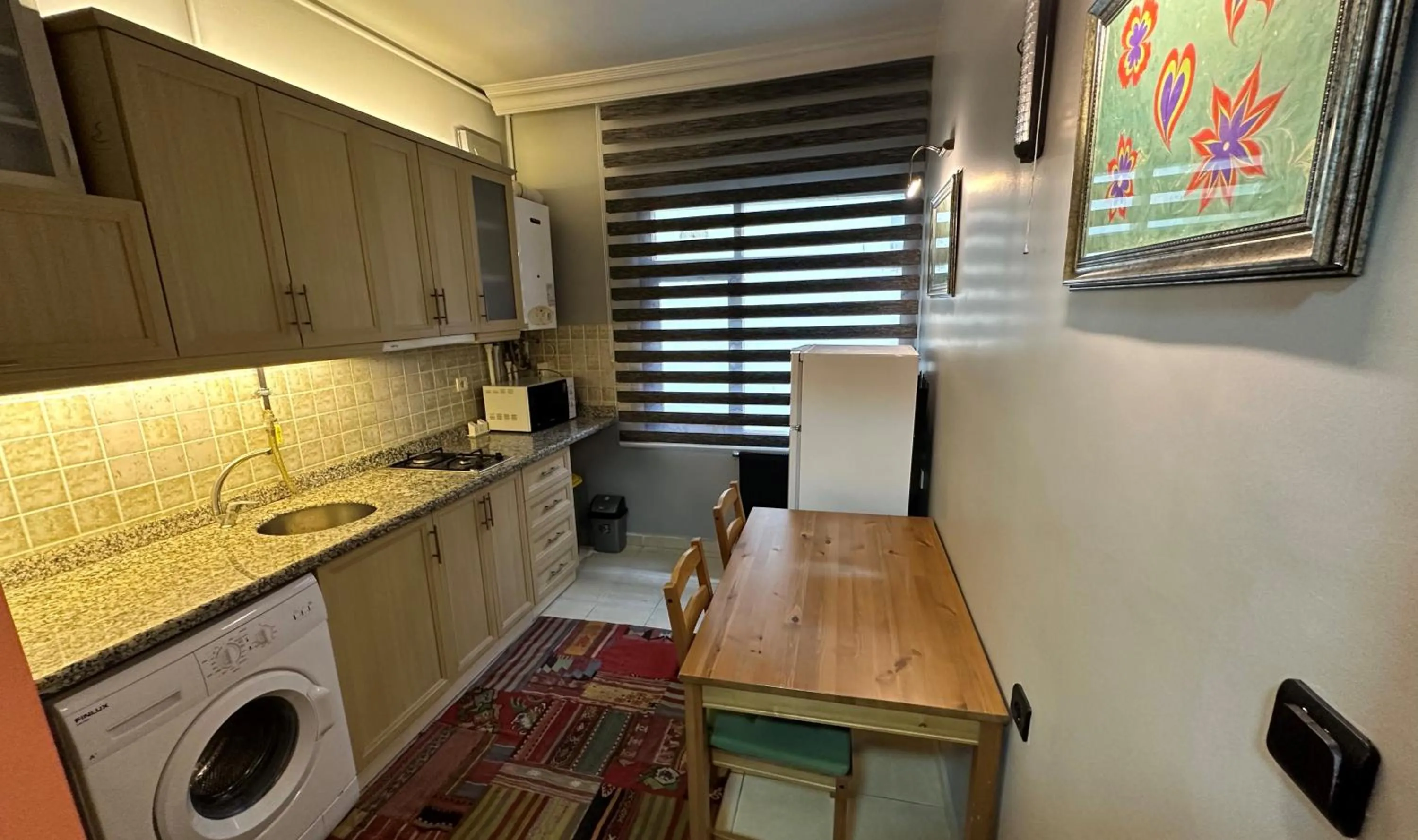 Kitchen or kitchenette in By Kinyas Hotel