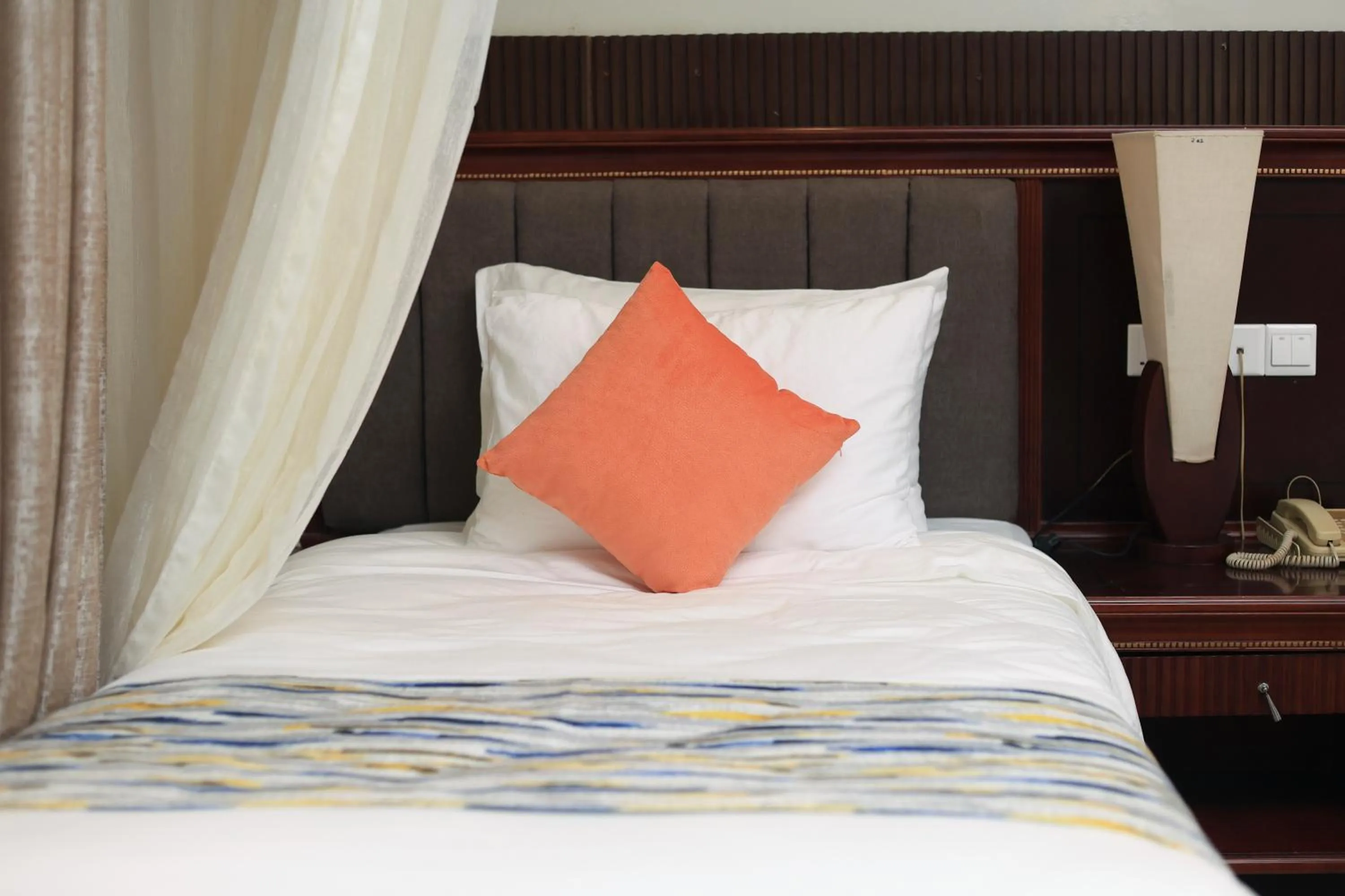 Bed in Royal Suites Hotel-Kampala