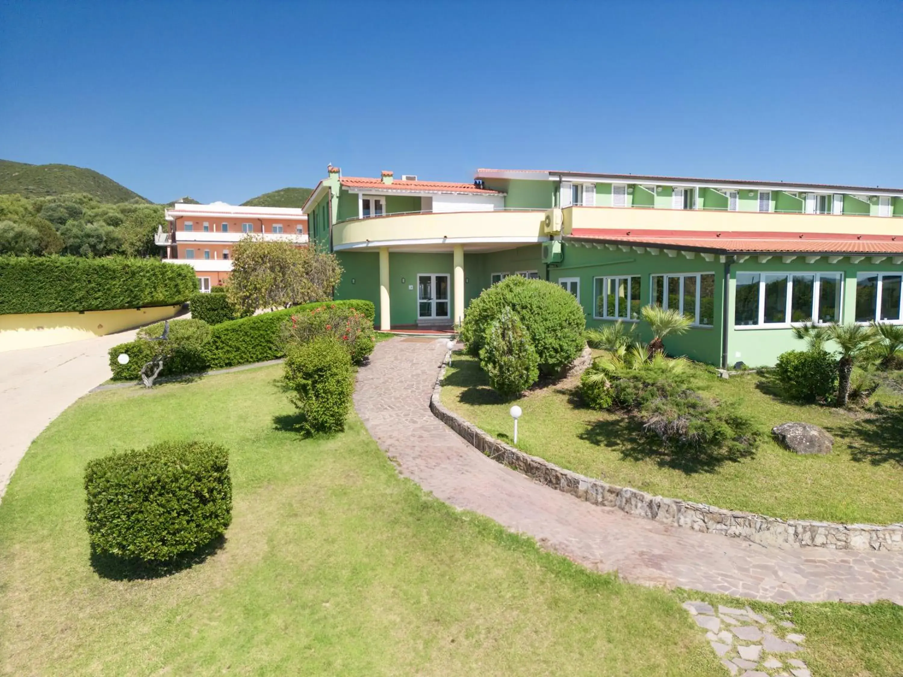 Property building in Lu' Hotel Porto Pino Property building in Lu' Hotel Porto Pino