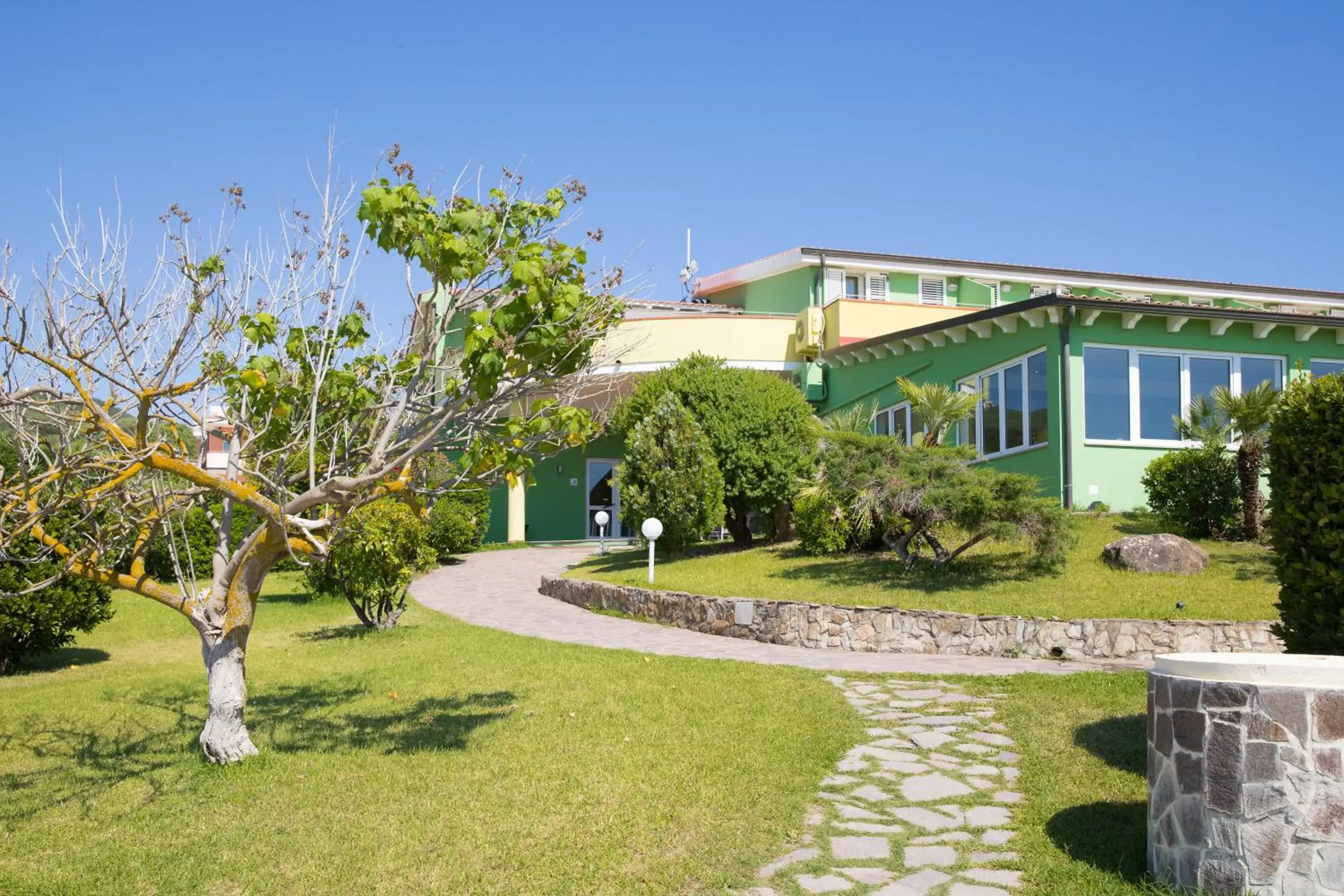 Property building in Lu' Hotel Porto Pino Property building in Lu' Hotel Porto Pino