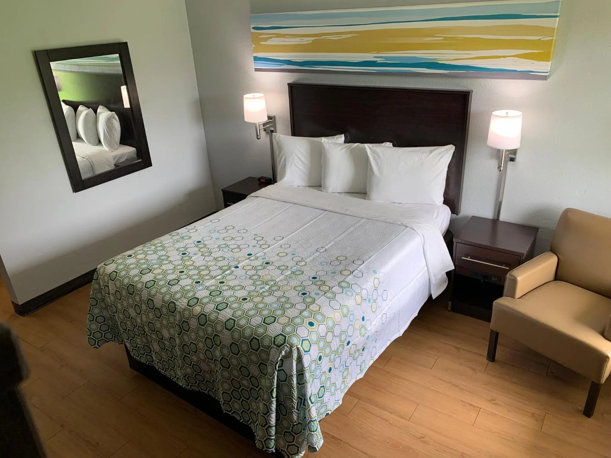 Bedroom, Bed in HomeTowne Studios by Red Roof Battle Creek