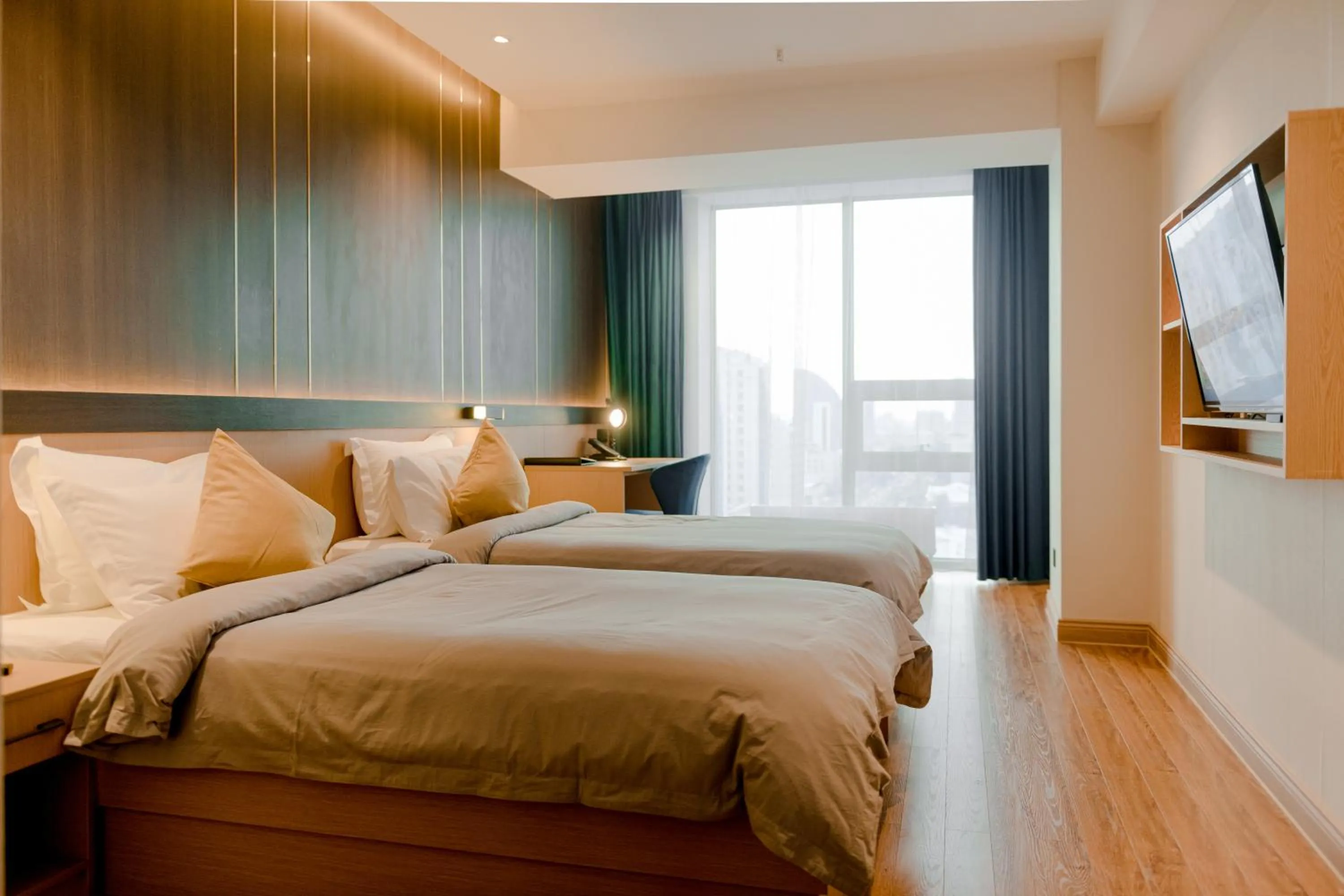 Photo of the whole room, Bed in MIllennium Plaza Hotel & Mall Ulaanbaatar