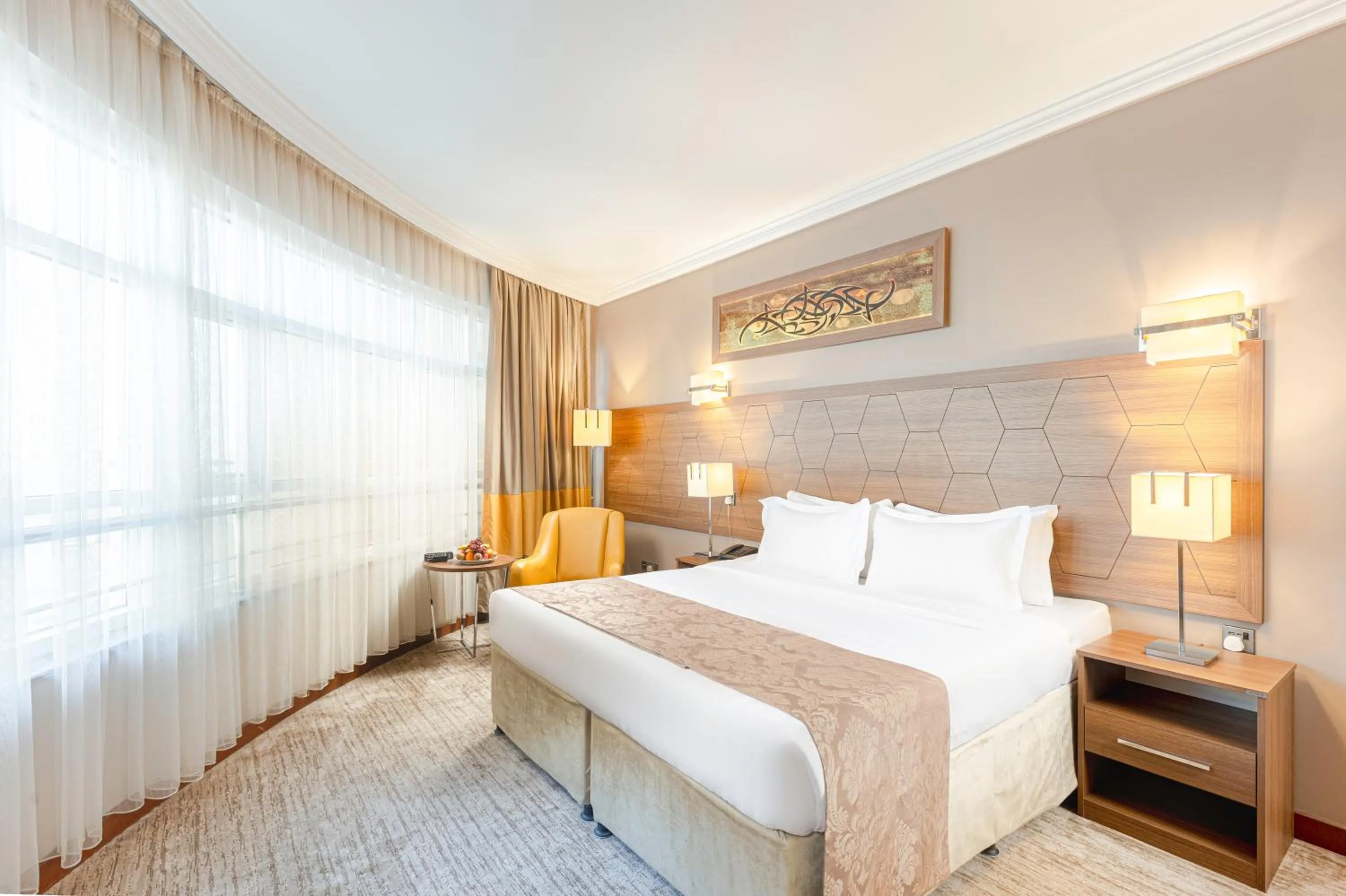 Bed in Diwan Rose Hotel