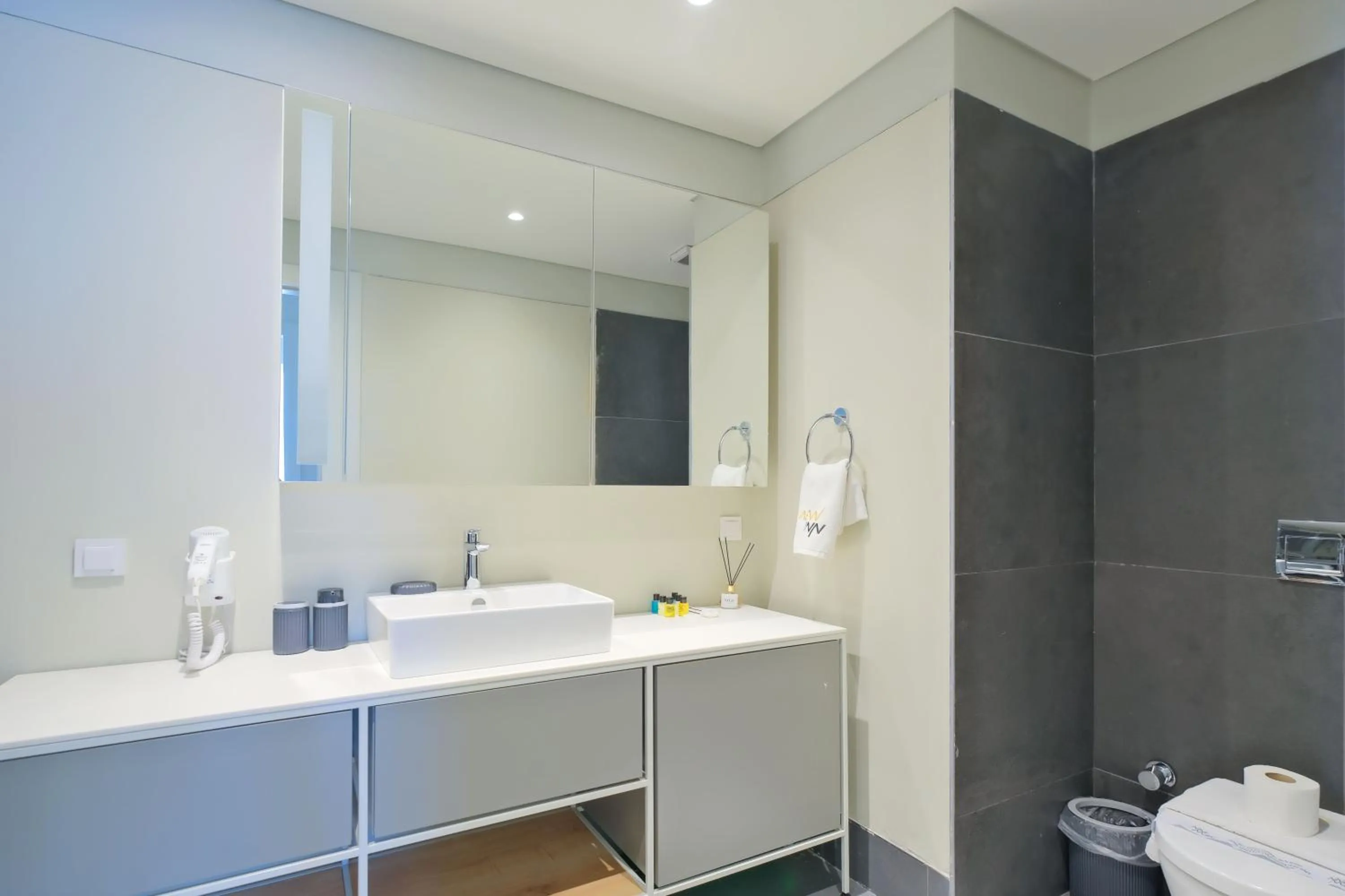 Bathroom in Roya Nova Residence by NewInn