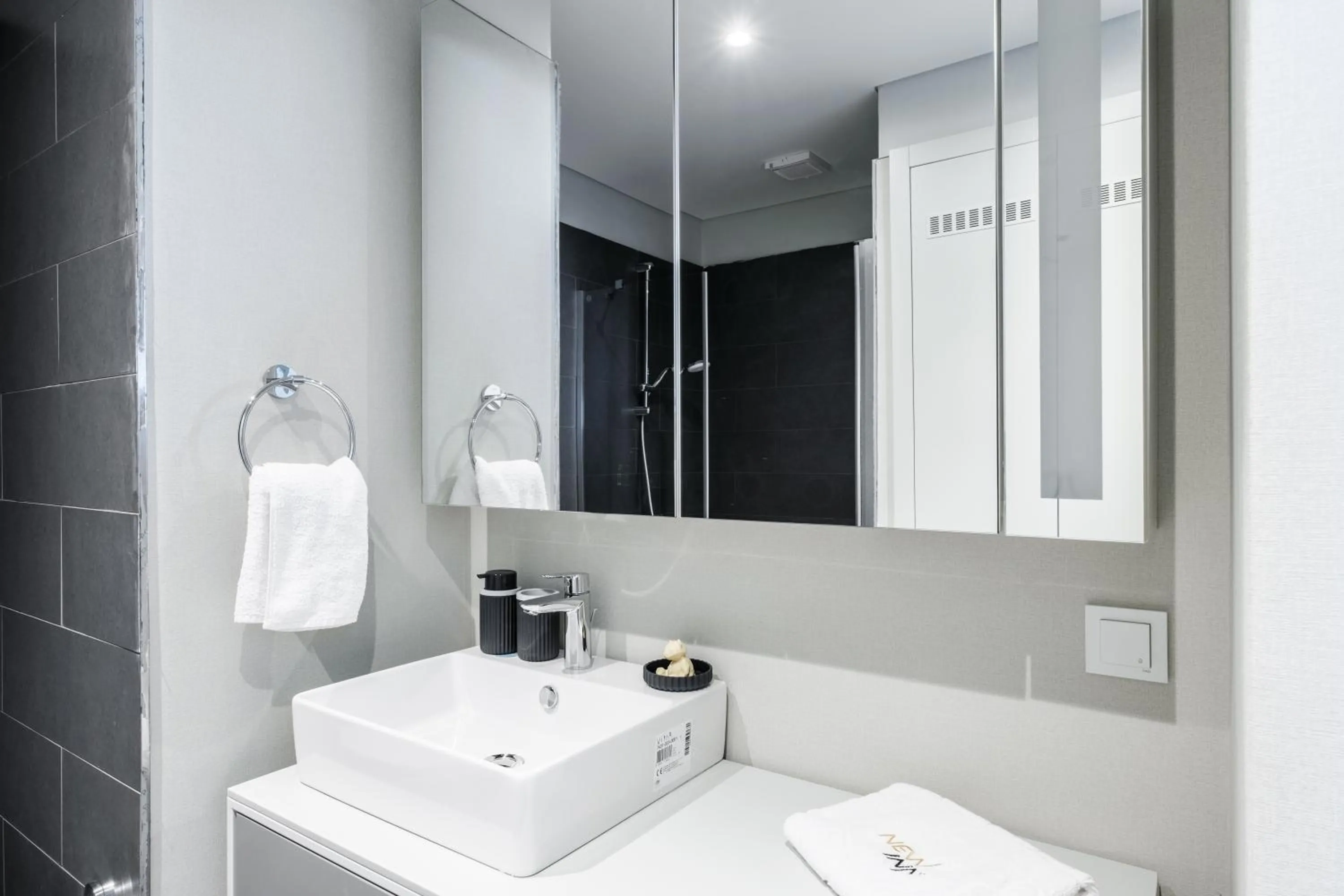 Bathroom in Roya Nova Residence by NewInn