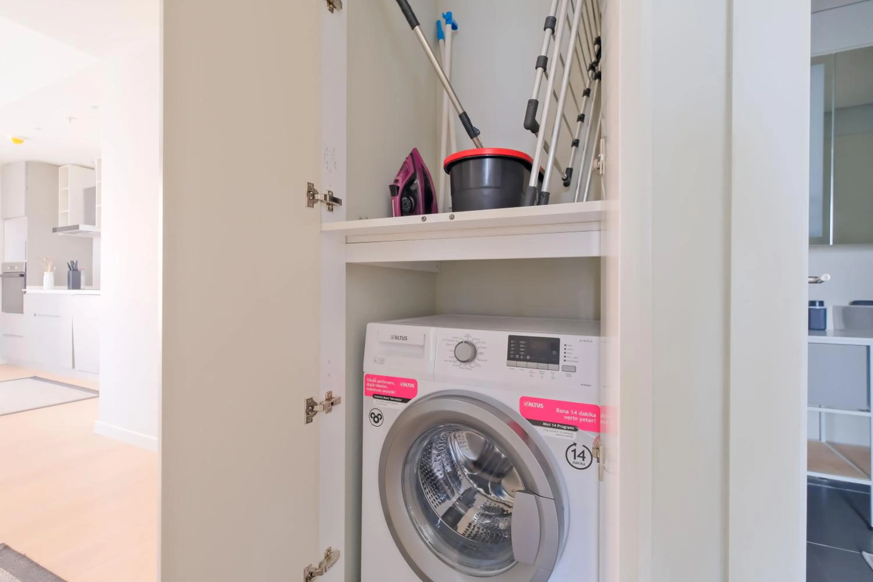 washing machine in Roya Nova Residence by NewInn