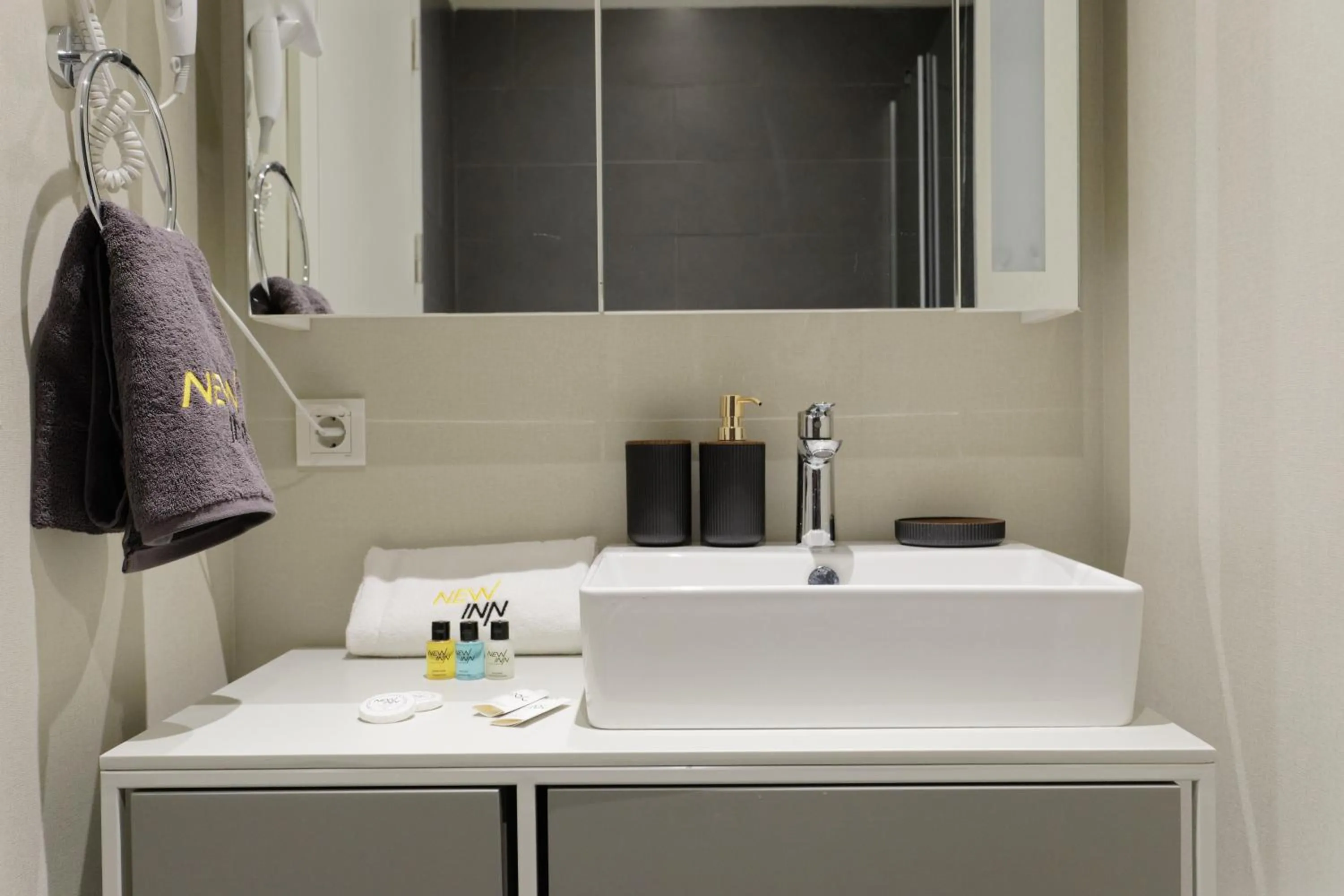 Bathroom in Roya Nova Residence by NewInn