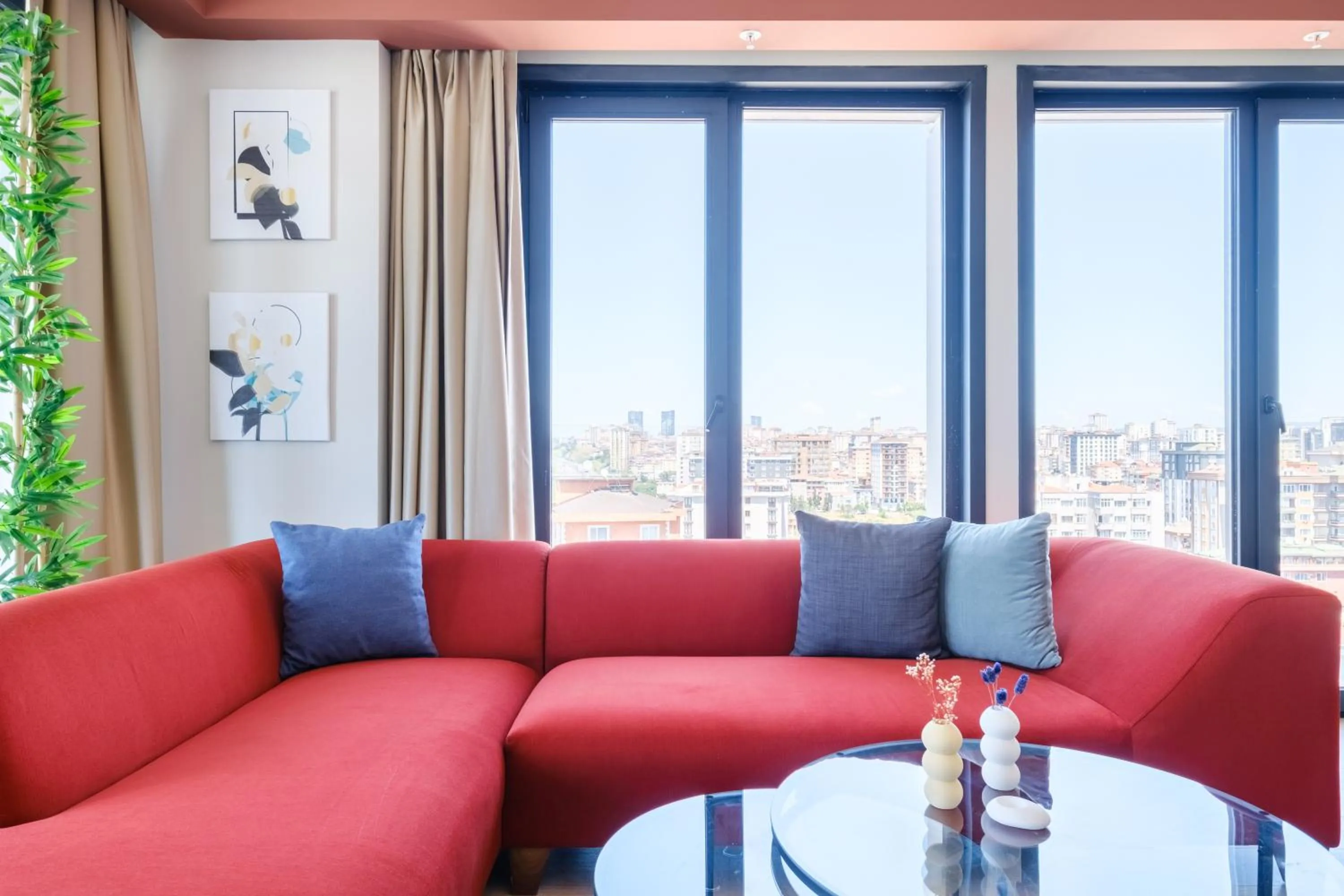 Living room in Roya Nova Residence by NewInn