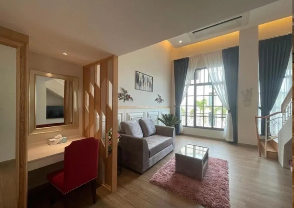 Living room, Bed in Grand Lord Hotel & Residence - Pattaya